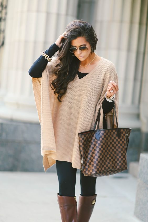 16 Thanksgiving Outfit Ideas featured by top US fashion blogger, Emily Gemma of The Sweetest Thing: cute fall thanksgiving outfitt 2017, cute pinterest outfit poncho and leggings and tory burch boots, emily ann gemma, the sweetest thing blog, all black outfit pinterest, easy cute casual womens outfit fall pinterest tumblr thanksgiving, fashion blogger fall outfits pinterest tumblr, louis vuitton Neverfull Damier Ebene MM outfit pinterest, cute outfits fall tory burch riding boots 