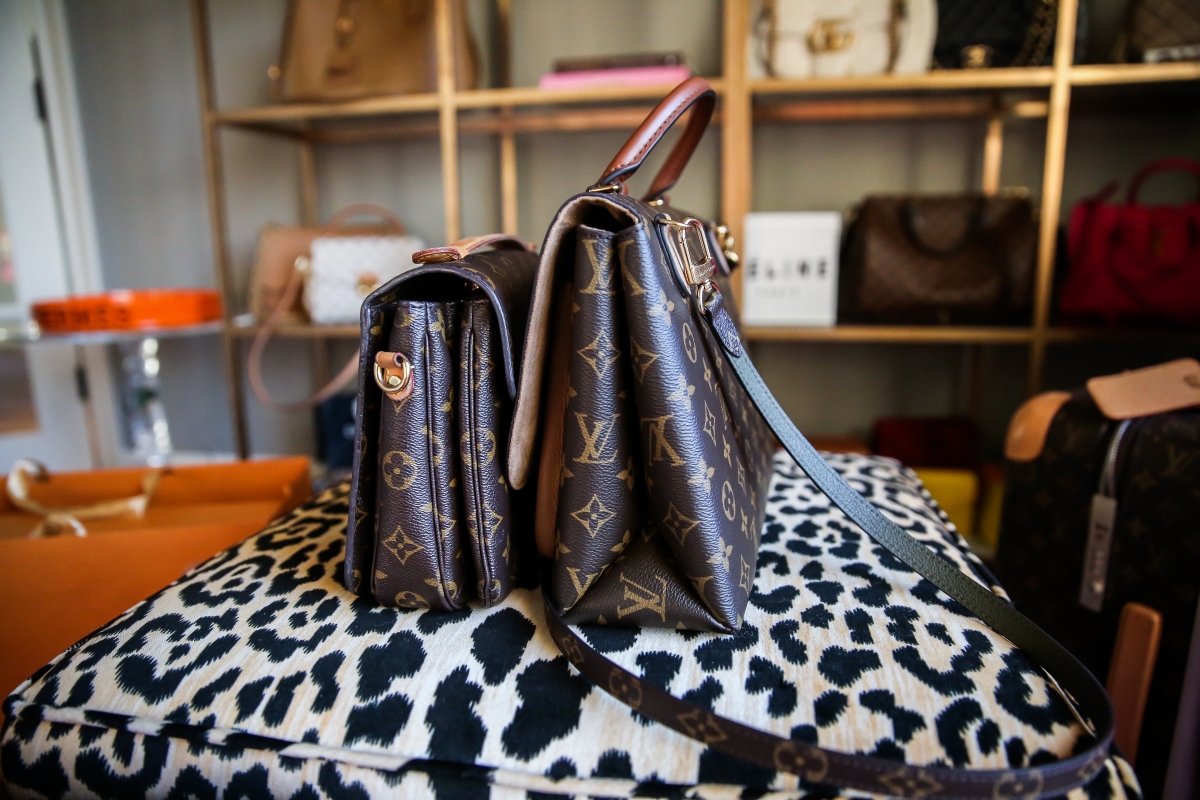 Louis Vuitton Marignan by popular US fashion blog, The Sweetest Thing: image of the Louis Vuitton Marignan messenger bag on a leopard print bench.