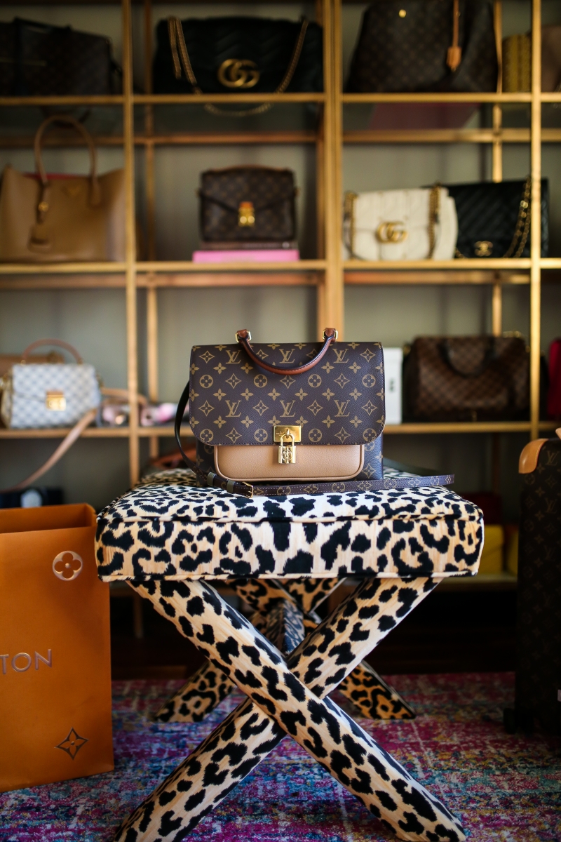 Louis Vuitton Marignan by popular US fashion blog, The Sweetest Thing: image of the Louis Vuitton Marignan messenger bag on a leopard print bench.