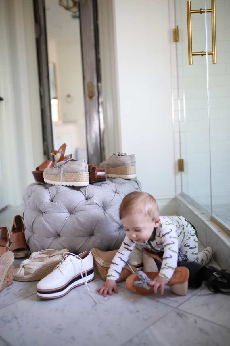 Cute Spring Shoes by popular US fashion blog, The Sweetest Thing: image of a baby playing with a pile of shoes. 