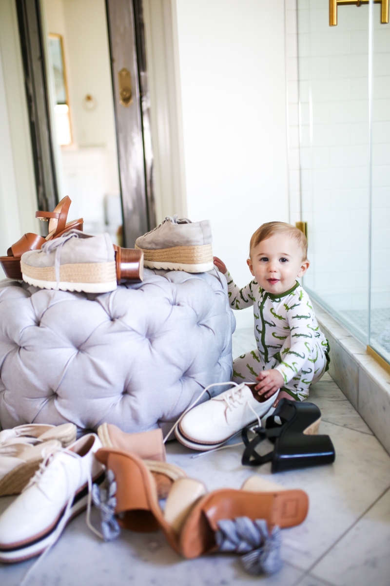 Cute Spring Shoes by popular US fashion blog, The Sweetest Thing: image of a little boy playing with a pile of shoes. 