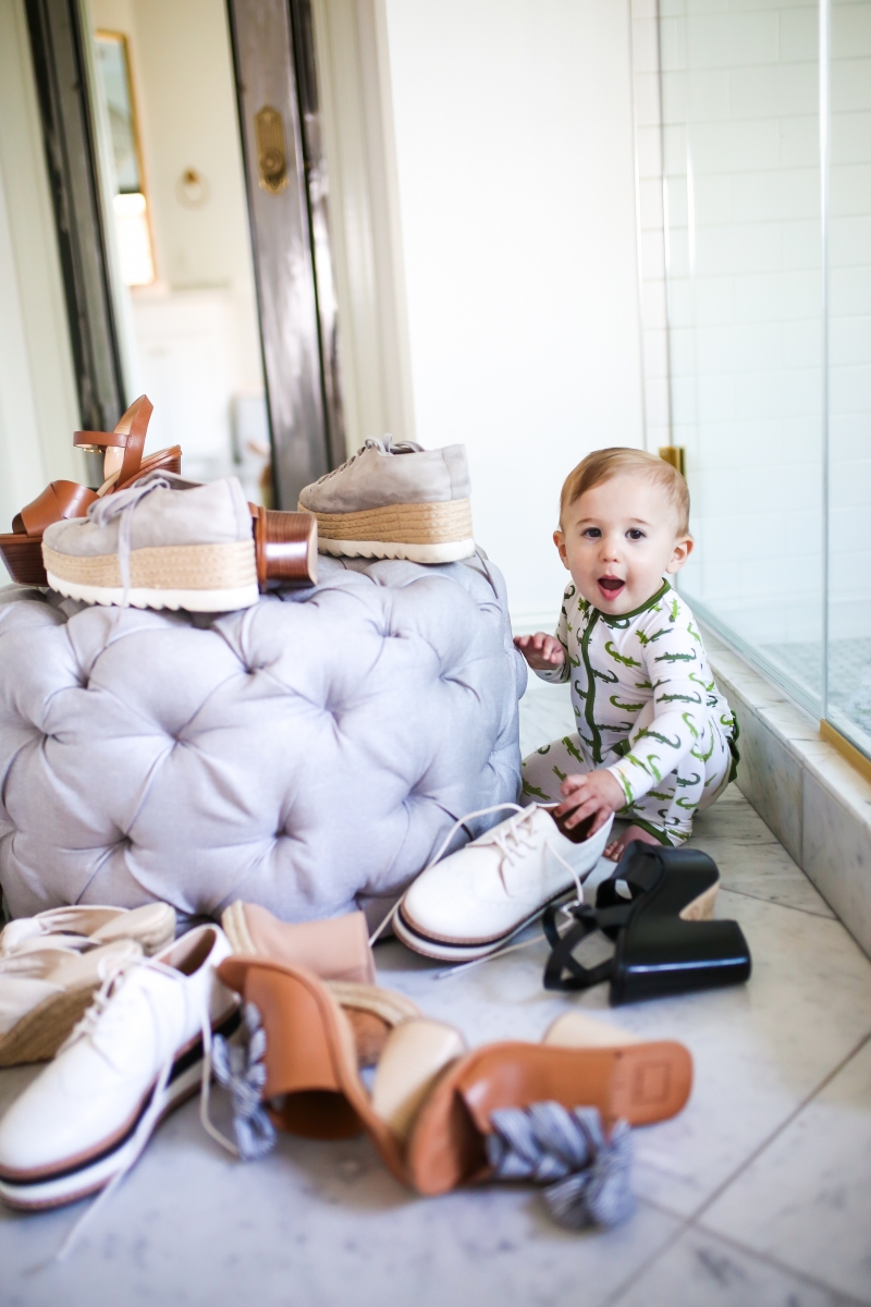 Cute Spring Shoes by popular US fashion blog, The Sweetest Thing: image of a baby playing with a pile of shoes. 