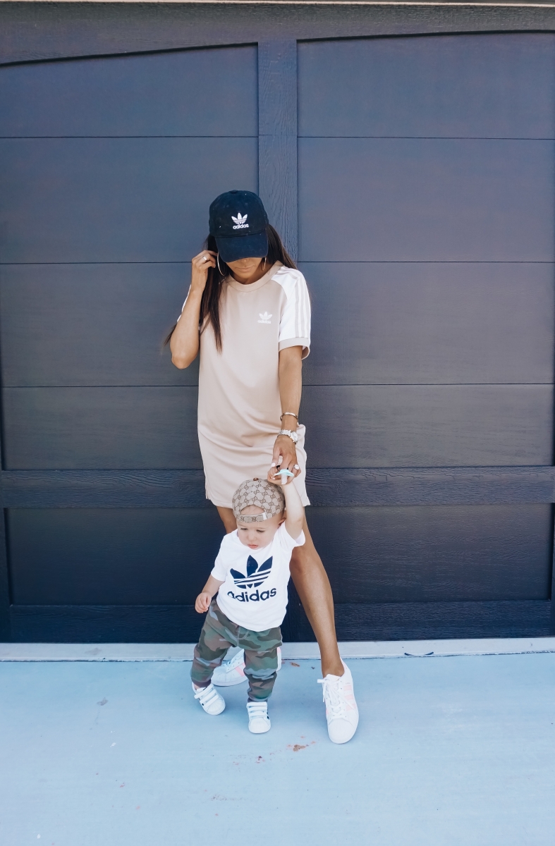 best #nsale kids outfits, cute baby boy fashion adidas, emily ann gemma, baby boy fashion fall pinterest 2018 | Cute Baby Boy Outfit by popular US fashion blog, The Sweetest Thing: image of a mom and her baby wearing Nordstrom adidas Trefoil Baseball Cap ADIDAS ORIGINALS, Nordstrom Caber Diamond Bracelet Watch, 35mm MICHELE, Nordstrom Trefoil Logo Tee ADIDAS ORIGINALS, Nordstrom Camo Knit Pants TUCKER + TATE, and Nordstrom baby Adidas shoes. 