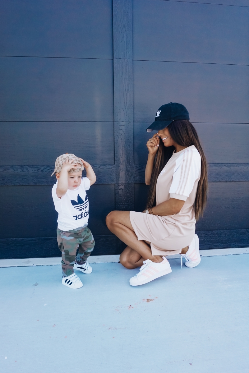 best #nsale kids outfits, cute baby boy fashion adidas, emily ann gemma, baby boy fashion fall pinterest 2018 | Cute Baby Boy Outfit by popular US fashion blog, The Sweetest Thing: image of a mom and her baby wearing Nordstrom adidas Trefoil Baseball Cap ADIDAS ORIGINALS, Nordstrom Caber Diamond Bracelet Watch, 35mm MICHELE, Nordstrom Trefoil Logo Tee ADIDAS ORIGINALS, Nordstrom Camo Knit Pants TUCKER + TATE, and Nordstrom baby Adidas shoes. 