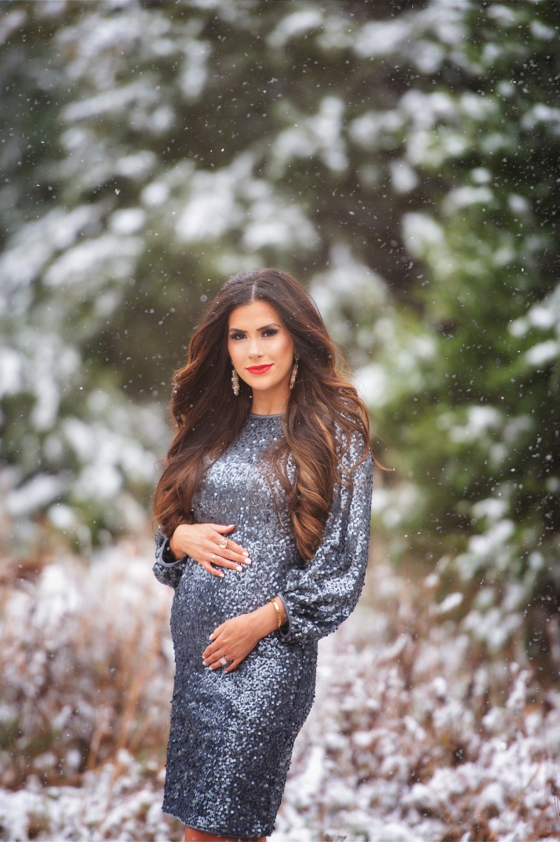 pregnancy announcement sequin dress, Emily ann gemma blog, sequin dress outfit pinterest 2018, holiday card snow and sequins | Sequin Leggings Outfit by popular US fashion blog, The Sweetest Thing: image of a woman wearing a silver sequin dress.