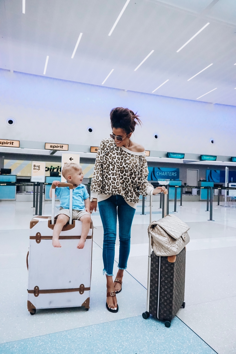 20 Easy To Re-Create Cute Travel Outfits featured by top US fashion and travel blogger, Emily Gemma of The Sweetest Thing: fall 2018 pinterest cute airport fashion outfit idea, cute airport travel fashion outfit fall 2018, emily gemma travel style, stylish cute casual travel outfit idea fall 2018, free people leopard oversized sweater, XXL Chanel airlines Tote gold review 