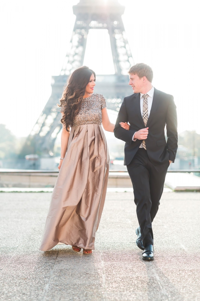styling sequins holidays 2018, emily ann gemma, pregnancy announcement paris | Sequin Leggings Outfit by popular US fashion blog, The Sweetest Thing: image of a woman wearing a taupe sequin dress and standing with her husband in front of the Eiffel Tower. 