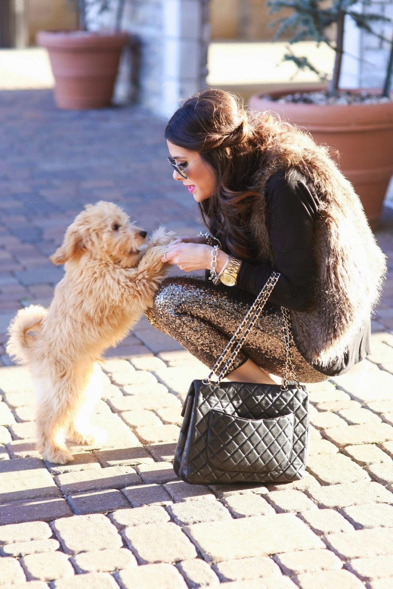 styling sequins holidays 2018, emily ann gemma, sequin pant outfit idea 2018 pinterest | Sequin Leggings Outfit by popular US fashion blog, The Sweetest Thing: image of a woman wearing gold sequin pants, a brown faux shag fur vest, black shirt and black stud heels. 