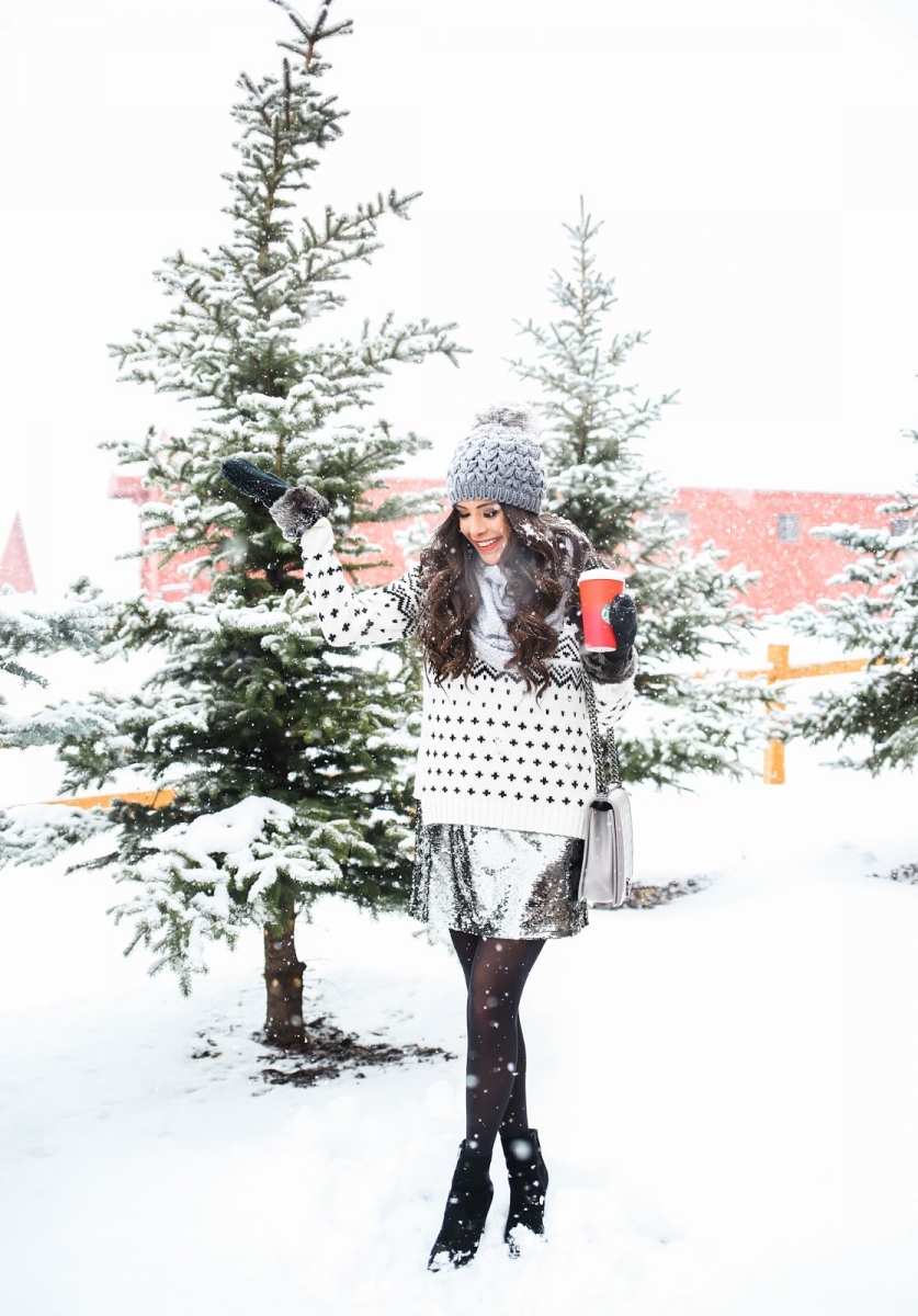 sequin skirt outfit idea holiday 2018 pinterest, Emily ann gemma | Sequin Leggings Outfit by popular US fashion blog, The Sweetest Thing: image of a woman wearing a silver sequin dress white and black sweater, black tights, grey pom pom beaning, and black ankle boots.