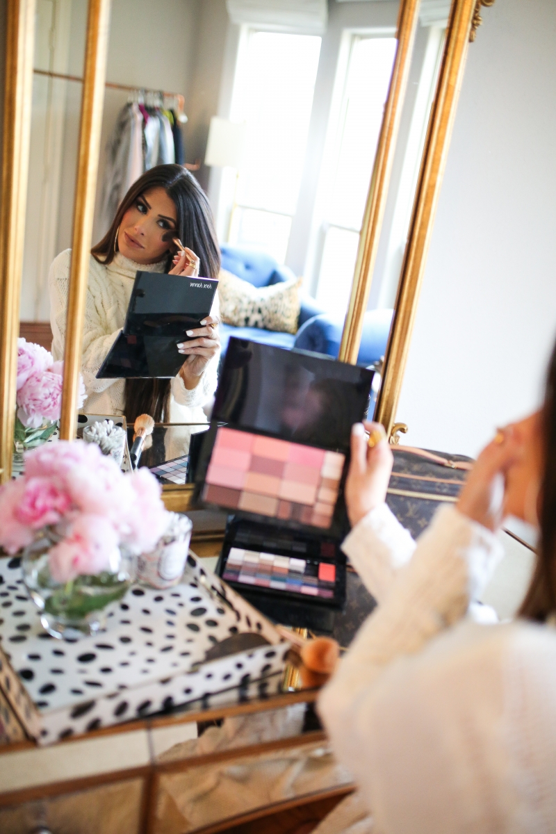 Mary Kay Reviews by popular US beauty blog, The Sweetest Thing: image of a woman using a Mary Kay makeup pallet.