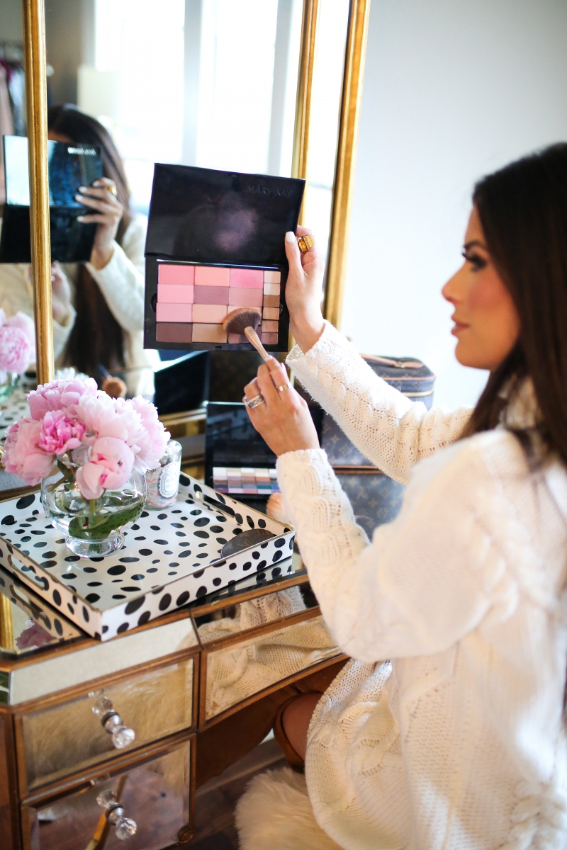 Mary Kay Reviews by popular US beauty blog, The Sweetest Thing: image of a woman using a Mary Kay makeup pallet. 