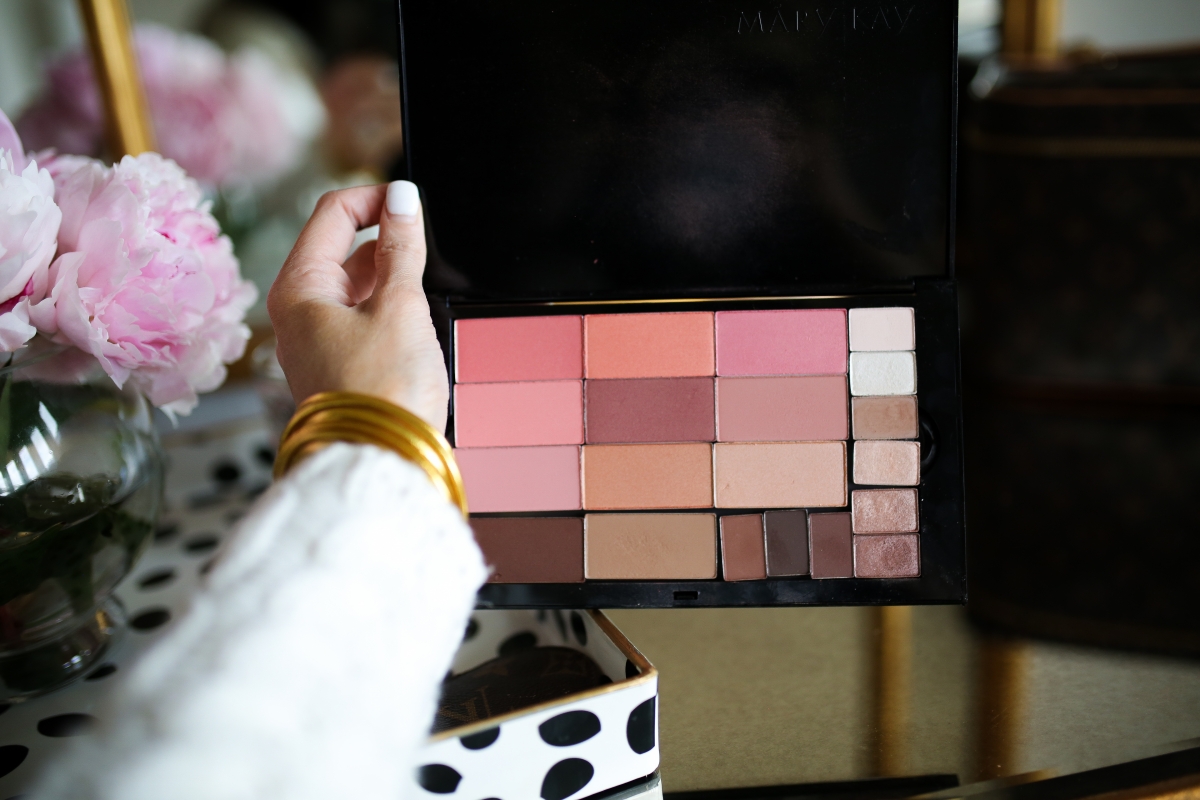 Mary Kay Reviews by popular US beauty blog, The Sweetest Thing: image of a woman holding a Mary Kay makeup pallet. 