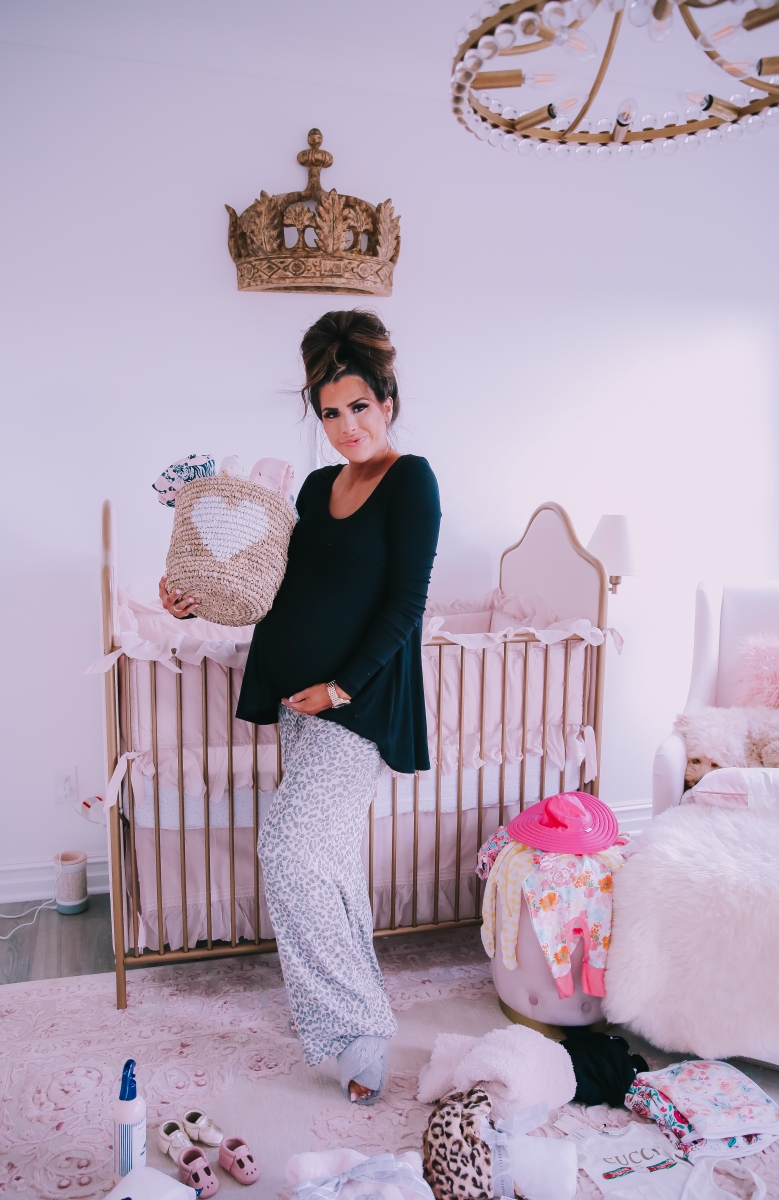 Emily Ann Gemma of The Sweetest Thing Blog in baby girl nursery. Favorite must have baby products.