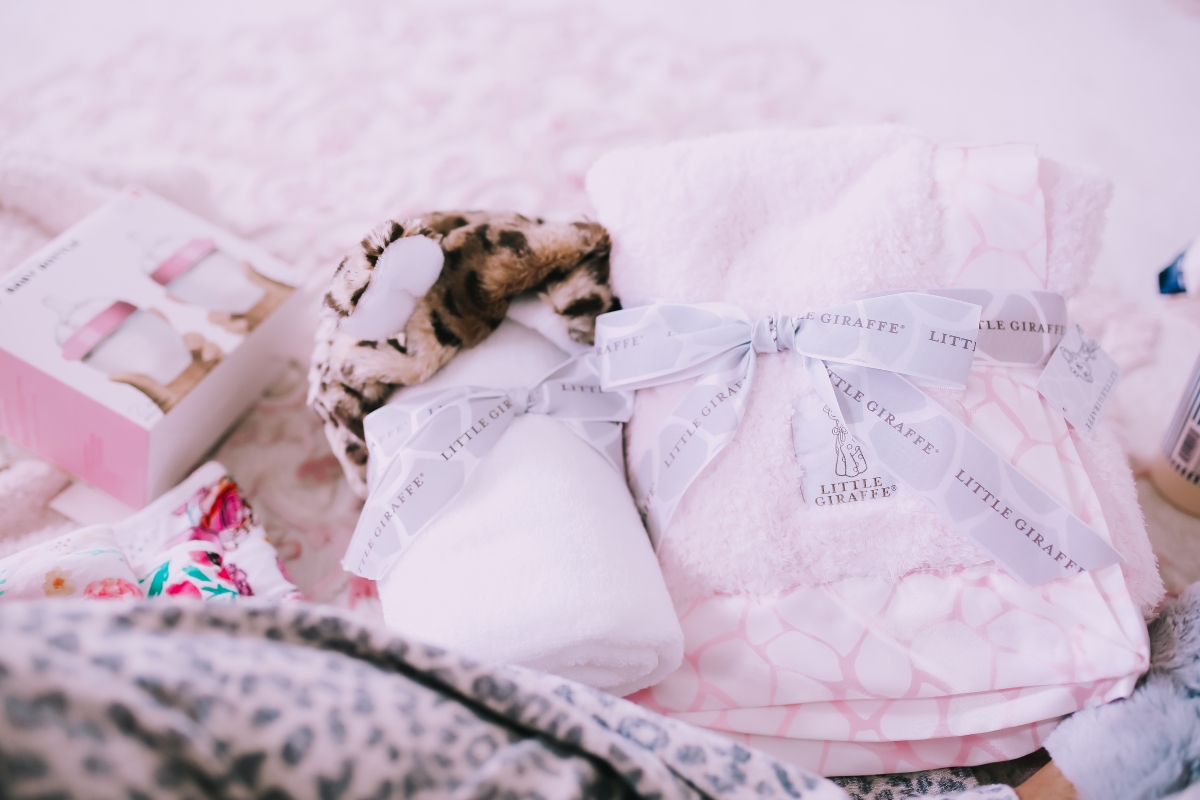 Emily Ann Gemma of The Sweetest Thing Blog in baby girl nursery. Favorite must have baby products.