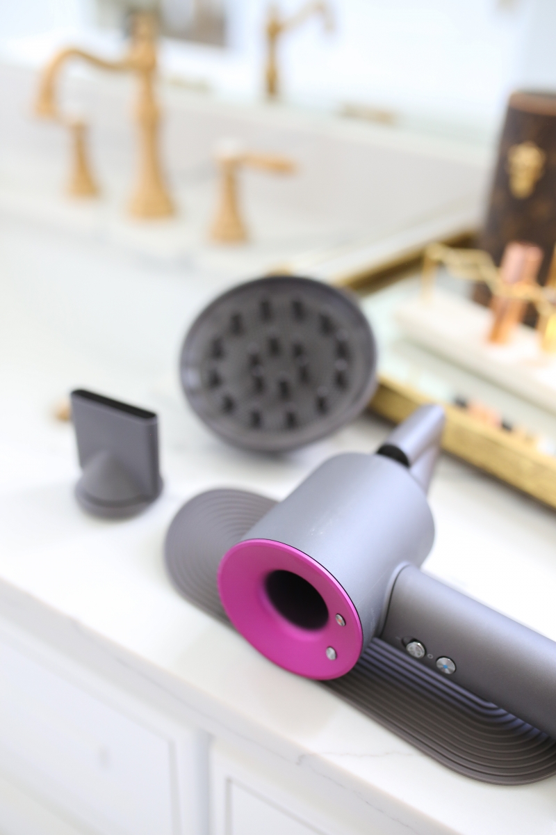 Emily Ann Gemma of The Sweetest Thing Blog review of the Dyson Hair Dryer. | Dyson Hair Dryer by popular US beauty blog, The Sweetest Thing: image of a Dyson hair dryer.