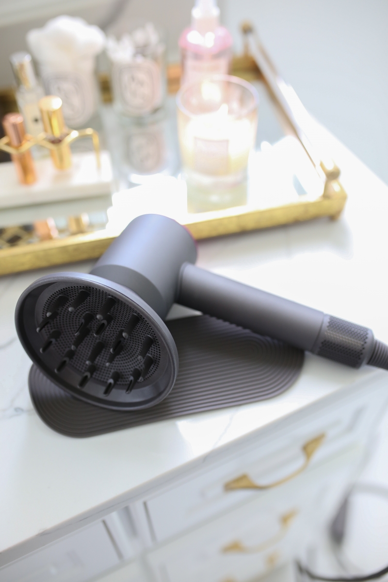 Emily Ann Gemma of The Sweetest Thing Blog review of the Dyson Hair Dryer. | Dyson Hair Dryer by popular US beauty blog, The Sweetest Thing: image of a Dyson hair dryer.