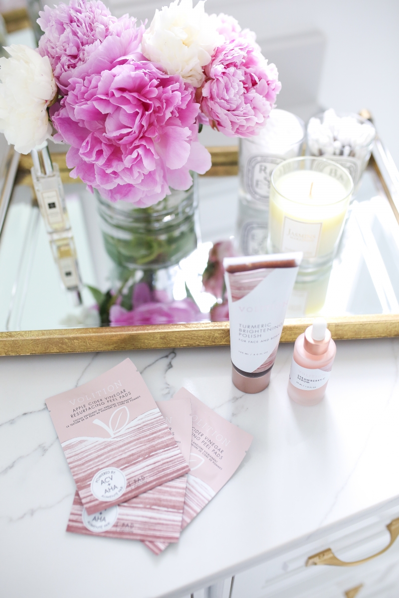 Emily Ann Gemma of The Sweetest Thing Blog reviewing Apple Cider Vinegar Resurfacing Pads + Strawberry C Serum For Your Face from Volition Beauty
