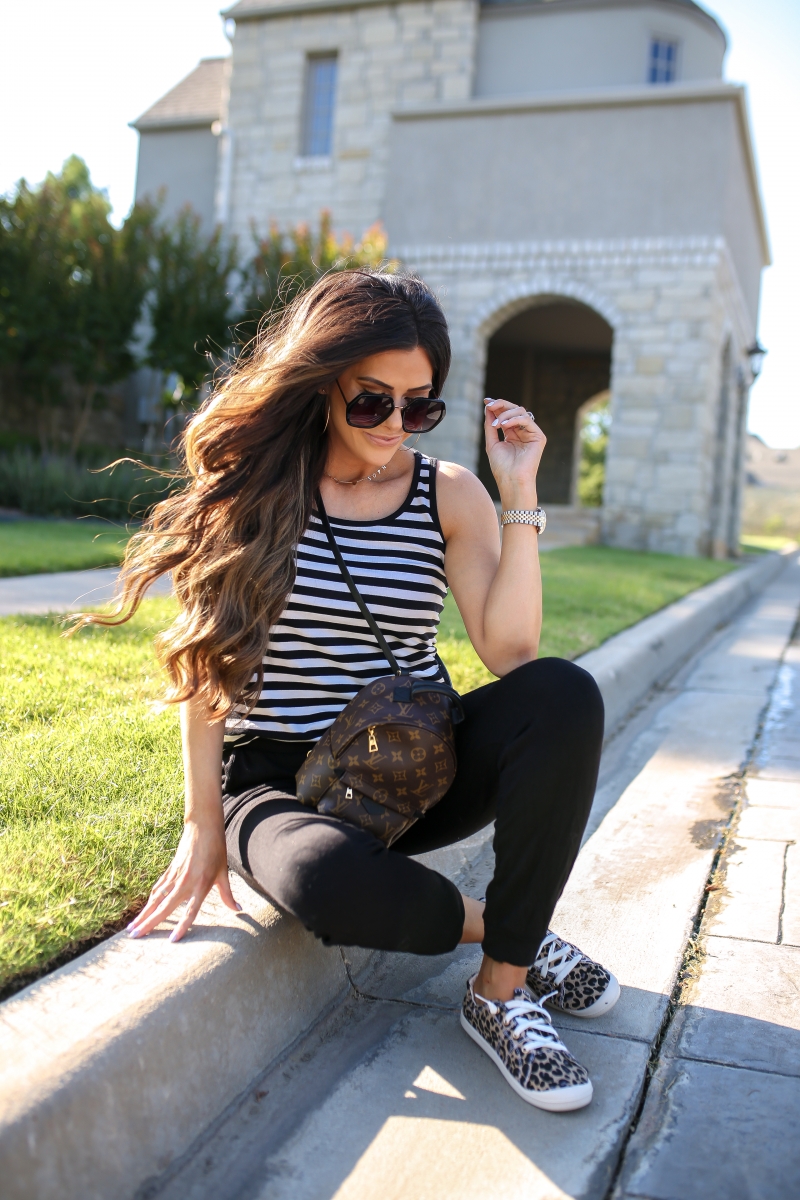 Emily Ann Gemma of The Sweetest Thing blog shares an affordable, Everyday Outfit Under $100 from Walmart. Louis Vuitton backpack, leopard shoes, striped tank, and black pants.