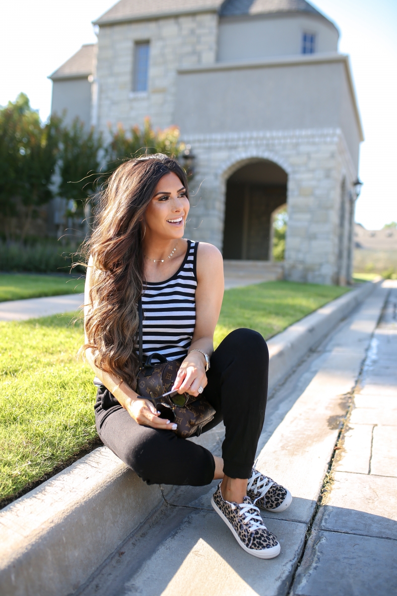 Emily Ann Gemma of The Sweetest Thing blog shares an affordable, Everyday Outfit Under $100 from Walmart. Louis Vuitton backpack, leopard shoes, striped tank, and black pants.