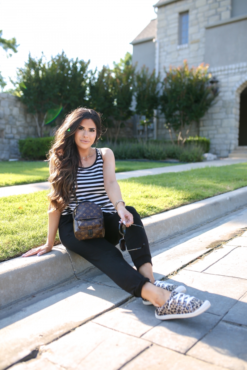 Emily Ann Gemma of The Sweetest Thing blog shares an affordable, Everyday Outfit Under $100 from Walmart. Louis Vuitton backpack, leopard shoes, striped tank, and black pants.