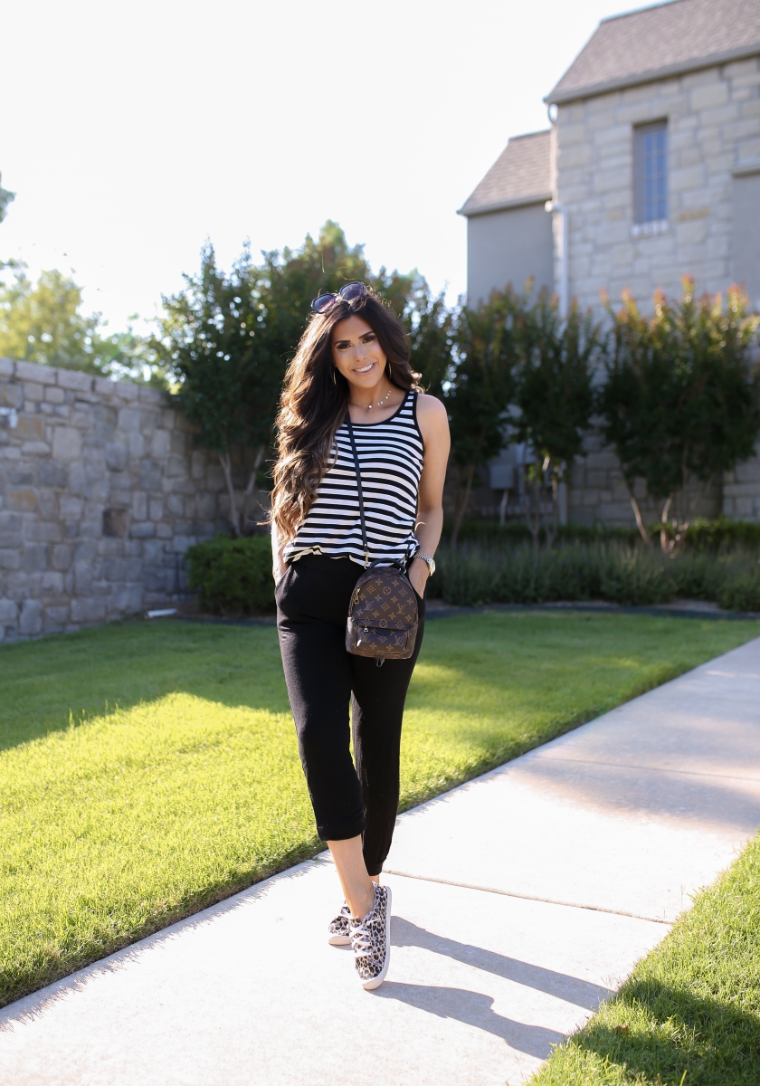 Emily Ann Gemma of The Sweetest Thing blog shares an affordable, Everyday Outfit Under $100 from Walmart. Louis Vuitton backpack, leopard shoes, striped tank, and black pants.