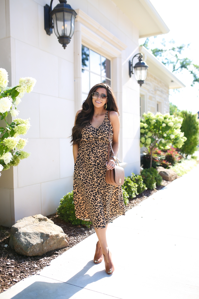 Emily Ann Gemma of The Sweetest Thing Blog wearing The Cutest Leopard Midi Dress [NSALE]. Tory Burch purse, brown heels, hoop earrings.