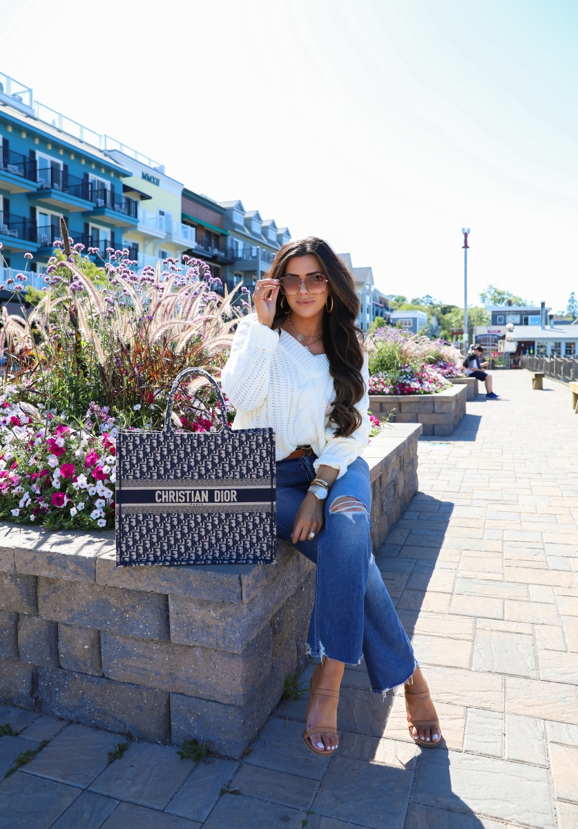 fall fashion pinterest 2019, Dior Book Tote Bag oblique navy, Bar Harbor Maine, emily gemma, Fall Fashion trends 2019, gucci 60mm sunglasses, Mother Tripper denim, Red dress boutique-2 | Off the Shoulder Sweater by popular US fashion blog, The Sweetest Thing: image of a woman outside wearing a Red Dress off the shoulder sweater, Revolve The Tripper MOTHER jeans, Nordstrom Amina Sandal ALIAS MAE, The Styled Collection necklaces, Louis Vuitton belt, Cartier bracelets, Rolex watch, Large Chunky Hoop Earrings ARGENTO VIVO, Nordstrom 60mm Gradient Square Sunglasses GUCCI, and holding a Louis Vuitton bag.