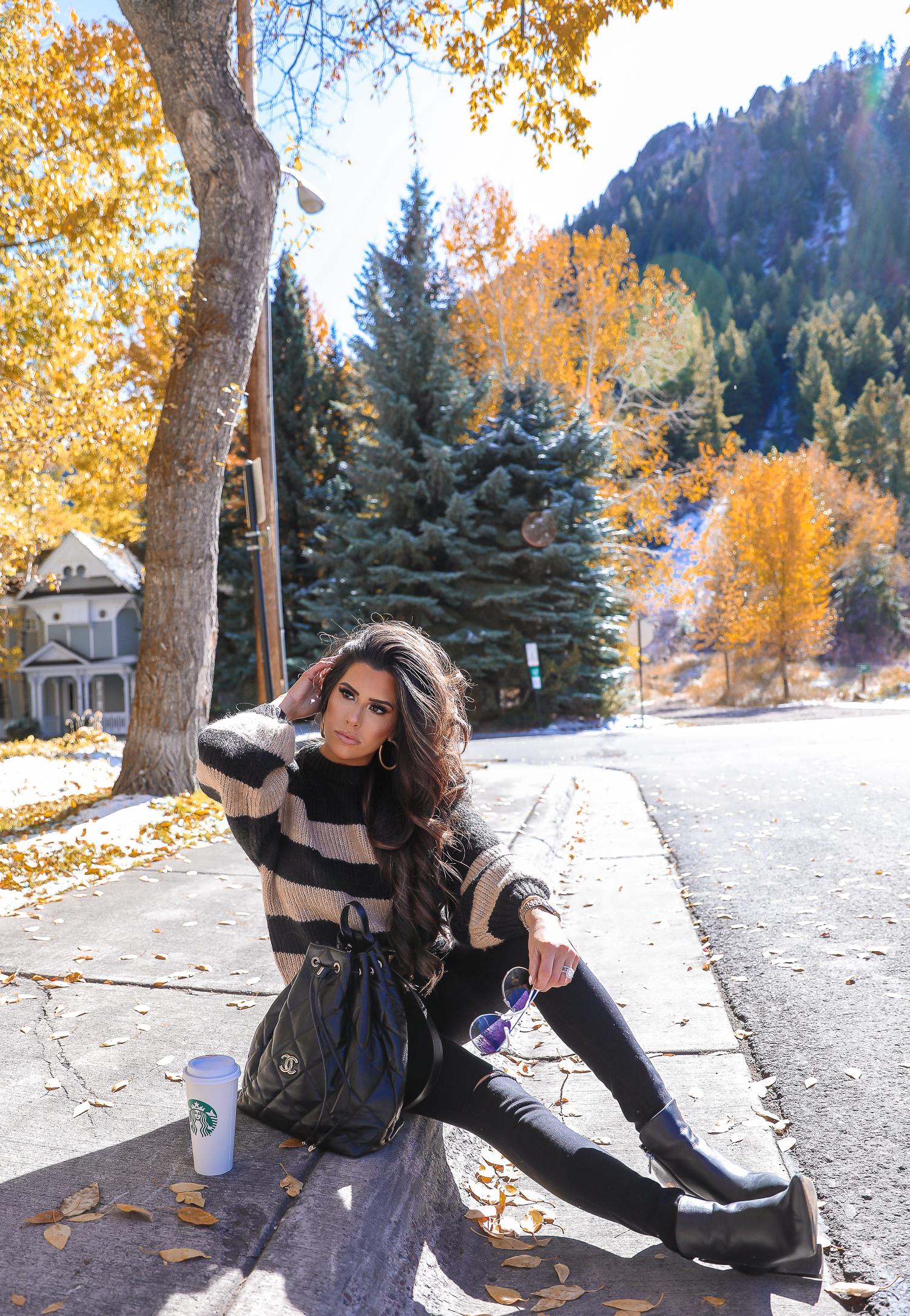 Easy Fall Look styled by top US fashion blog, The Sweetest Thing: image of a woman wearing a Nordstrom striped sweater, Madewell jeans, Marc Fisher booties, Chanel belt, and a Rolex watch | Fall outift ideas 2019 pinterest, Aspen what to wear fall, black chanel backpack quilted 2019, quay rimless aviator black, emily gemma, top popular fall fashion bloggers-2