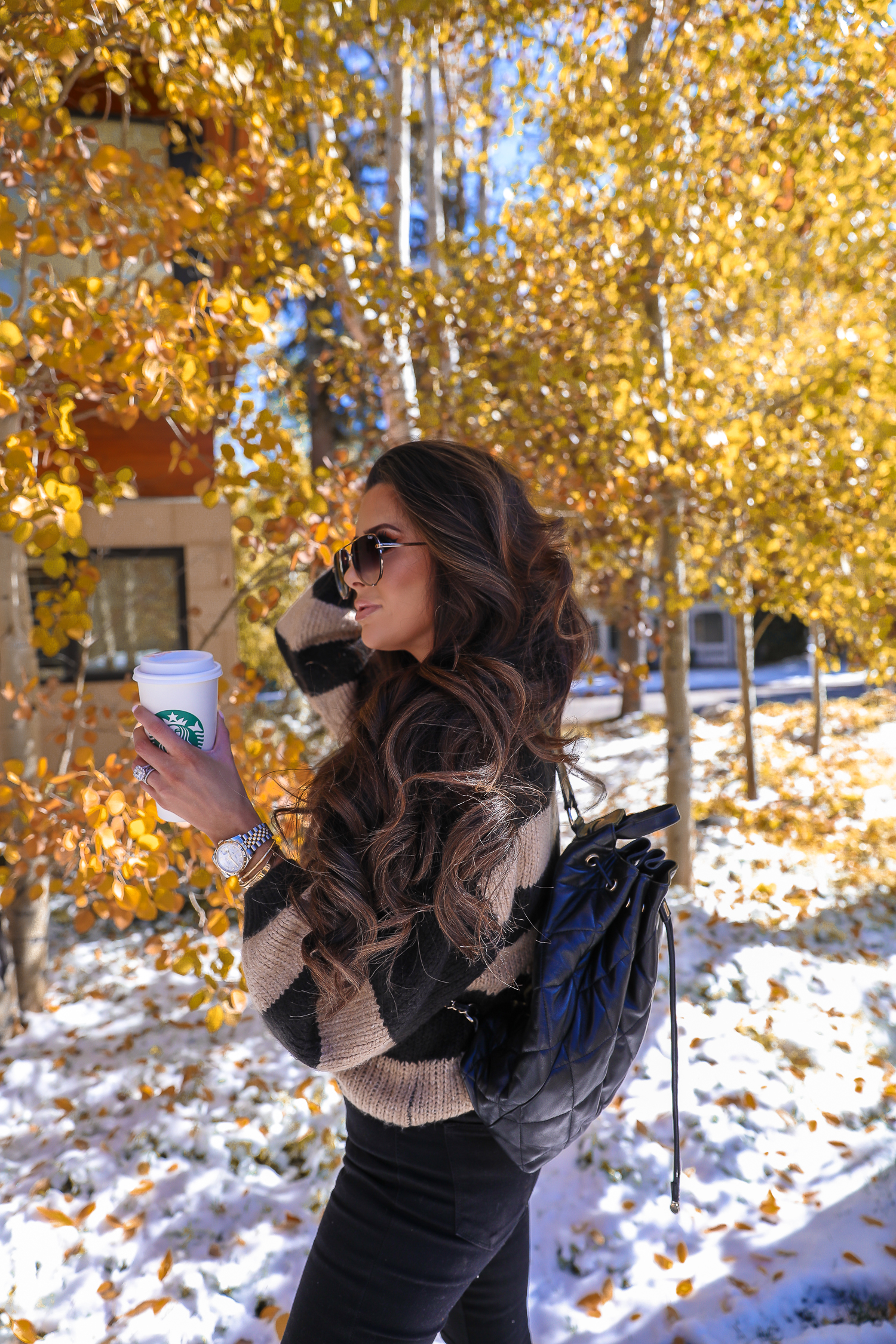 Easy Fall Look styled by top US fashion blog, The Sweetest Thing: image of a woman wearing a Nordstrom striped sweater, Madewell jeans, Marc Fisher booties, Chanel belt, and a Rolex watch | Fall outift ideas 2019 pinterest, Aspen what to wear fall, black chanel backpack quilted 2019, quay rimless aviator black, emily gemma, top popular fall fashion bloggers-2