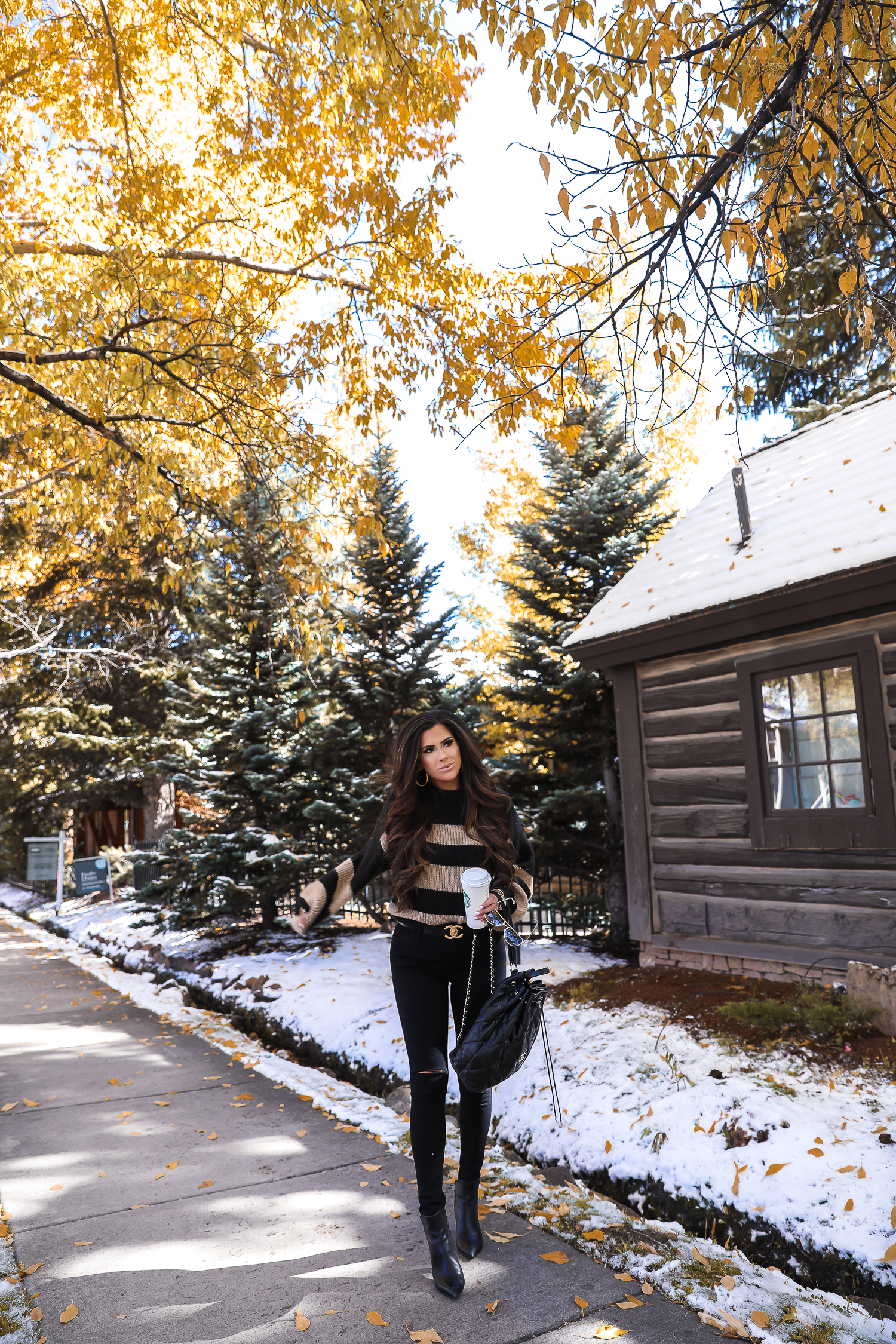 Easy Fall Look styled by top US fashion blog, The Sweetest Thing: image of a woman wearing a Nordstrom striped sweater, Madewell jeans, Marc Fisher booties, Chanel belt, and a Rolex watch | Fall outift ideas 2019 pinterest, Aspen what to wear fall, black chanel backpack quilted 2019, quay rimless aviator black, emily gemma, top popular fall fashion bloggers-2