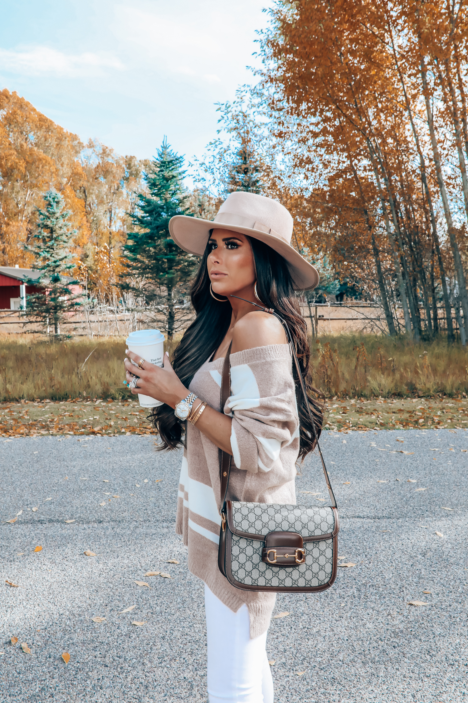 Rag and Bone White Jeans style for Fall by top US fashion blog, The Sweetest Thing: image of a woman wearing Rag and Bone white denim jeans, a Red Dress Boutique off the shoulder striped sweater, Gianni Bini boots, Gucci 1955 shoulder bag, Brixton Panama hat, Rolex watch, Cartier bracelets, Argento Vivo earrings, and a Free People ring | gucci 1055 horsebit bag, fall fashion 2019 pinterest, emily ann gemma