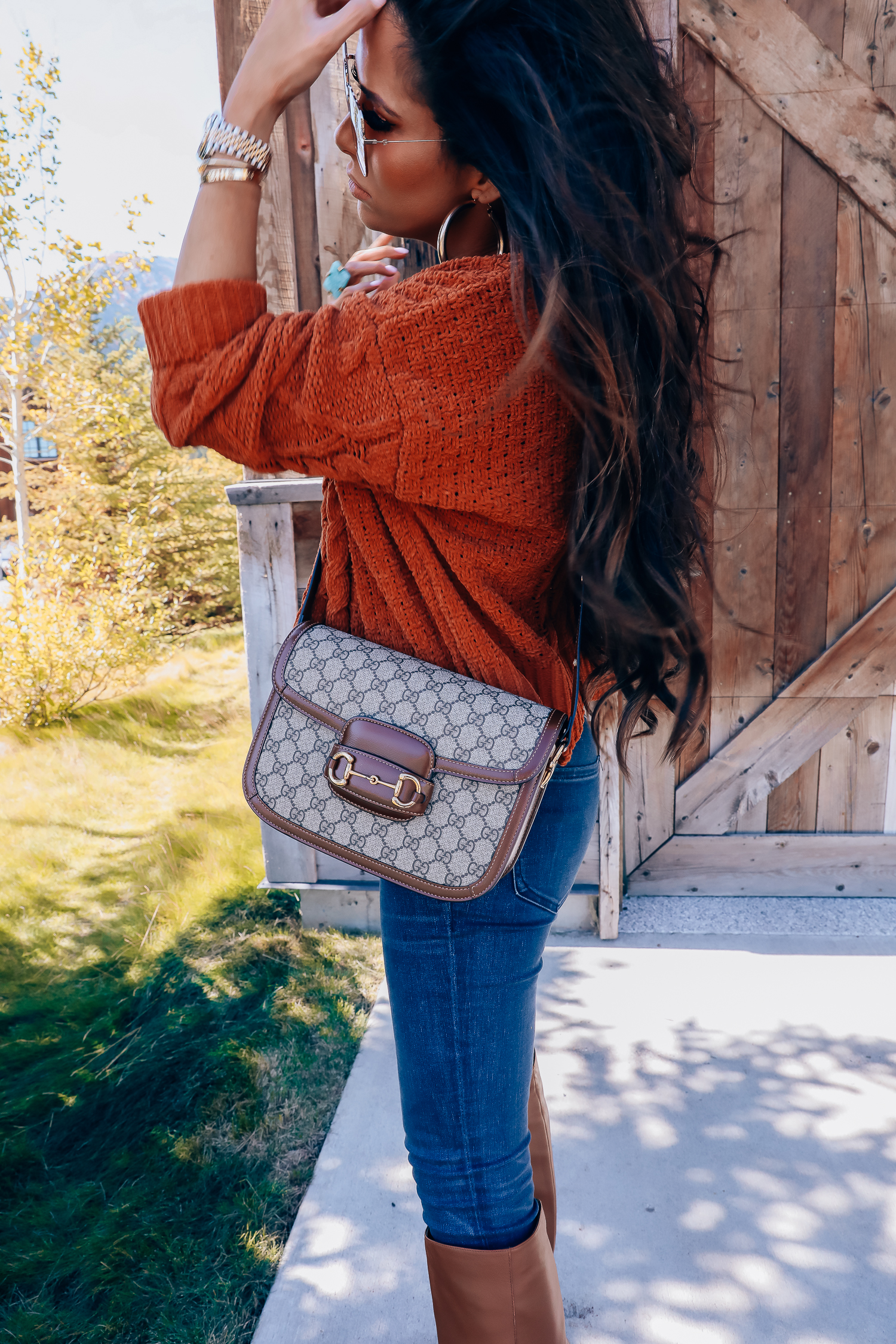 Fall fashion outfit featured by top US fashion blog, The Sweetest Thing: image of a woman wearing a BlankNYC rust sweater, Express denim leggings, Sam Edelman boots, Gucci 1955 shoulder bag, Cartie bracelets, Argento Vivo earrings, Gucci sunglasses and a Free People ring.| fall fashion outfits pinterest 2019, gucci vintage 1955 fall, emily ann gemma, sam edelman brown leather boots_-2