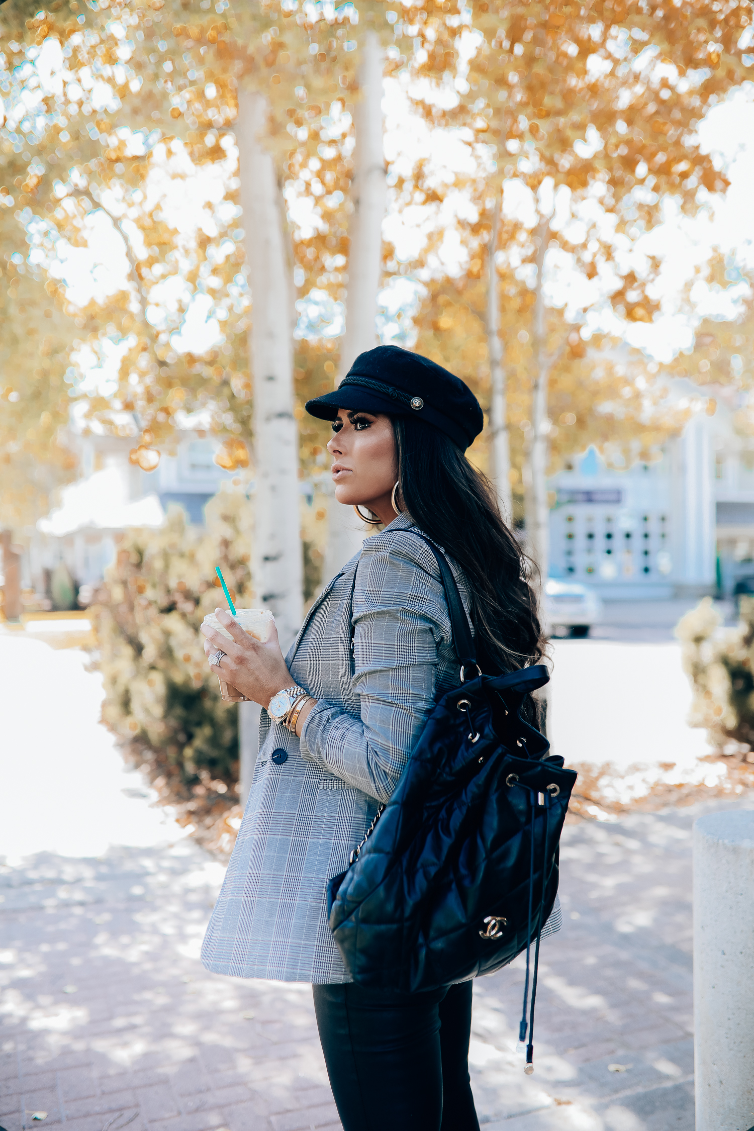 Oversized plaid blazer styled for Fall by top US fashion blog, The Sweetest Thing: image of a woman wearing an Aqua oversized plaid blazer, Splendid long sleeve top, BlankNYC vegan leggings, Marc Fisher booties, Chanel backpack, Baker boy cap, a Rolex watch, Argento Vivo earrings, and Cartier bracelets | fall fashion outfits pinterest 2019, plaid blazer outfit fall, leather pants outfit fall, how to style a plaid blazer fall trends 2019, emily ann gemma-19