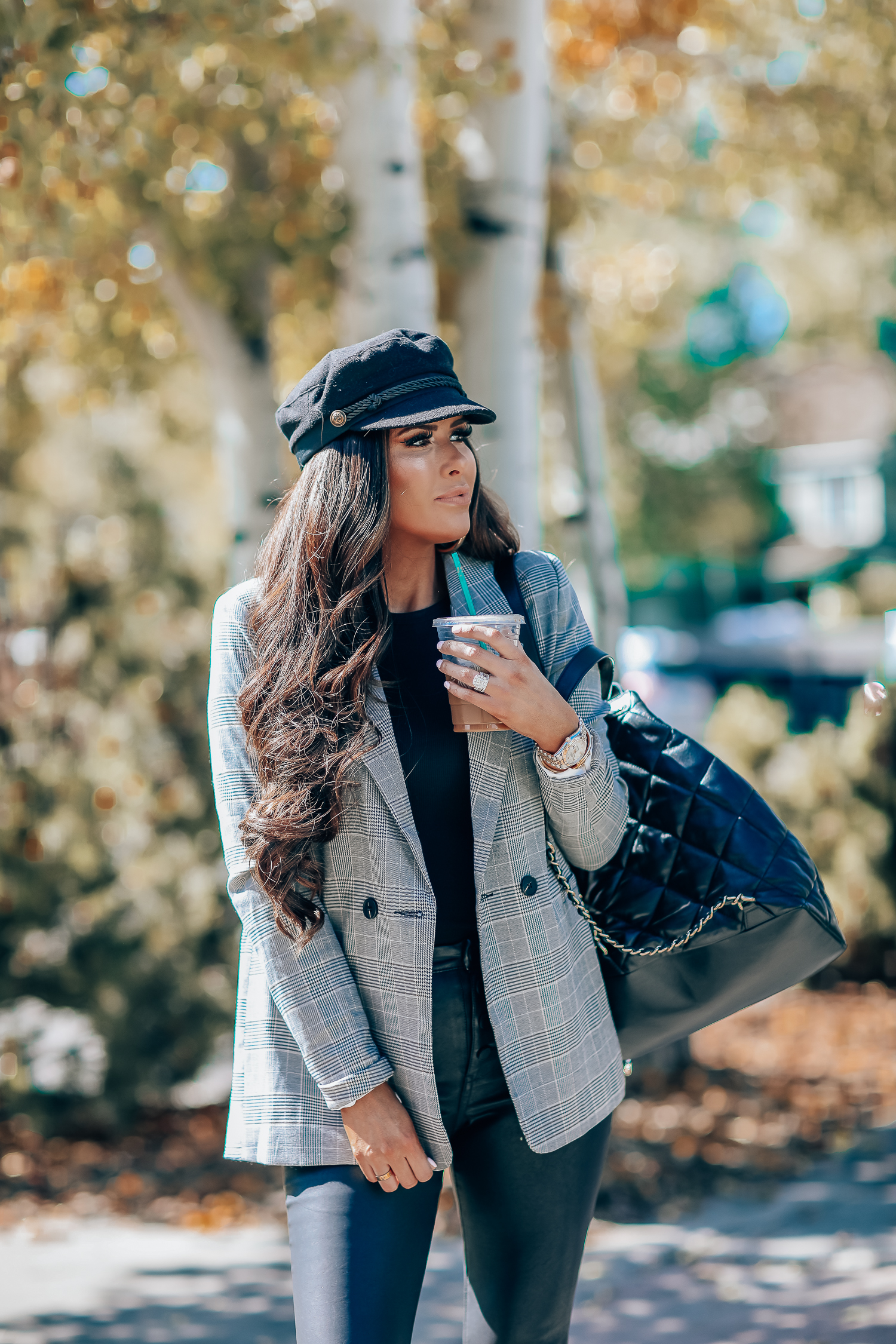 Oversized plaid blazer styled for Fall by top US fashion blog, The Sweetest Thing: image of a woman wearing an Aqua oversized plaid blazer, Splendid long sleeve top, BlankNYC vegan leggings, Marc Fisher booties, Chanel backpack, Baker boy cap, a Rolex watch, Argento Vivo earrings, and Cartier bracelets | fall fashion outfits pinterest 2019, plaid blazer outfit fall, leather pants outfit fall, how to style a plaid blazer fall trends 2019, emily ann gemma-19