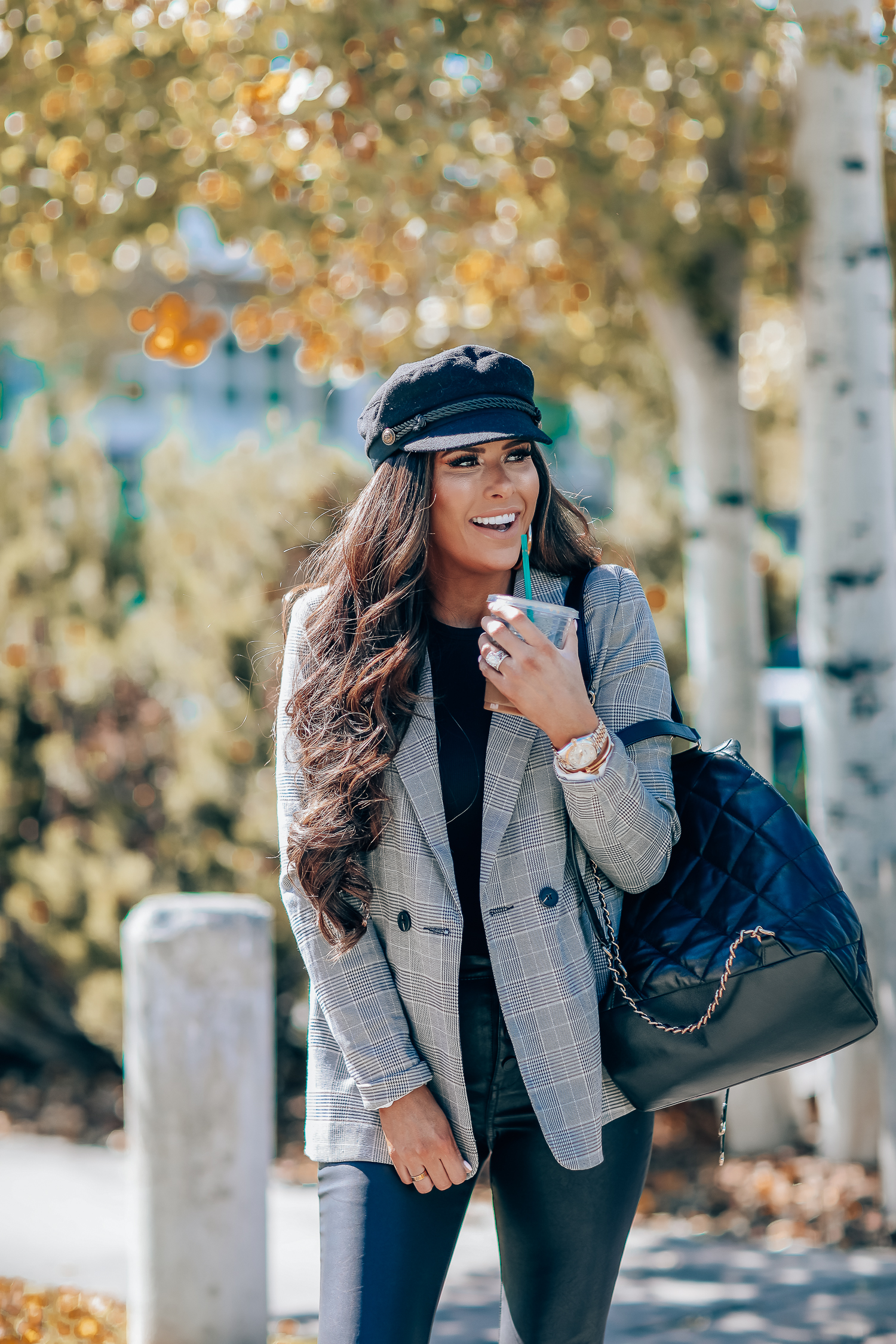 Oversized plaid blazer styled for Fall by top US fashion blog, The Sweetest Thing: image of a woman wearing an Aqua oversized plaid blazer, Splendid long sleeve top, BlankNYC vegan leggings, Marc Fisher booties, Chanel backpack, Baker boy cap, a Rolex watch, Argento Vivo earrings, and Cartier bracelets | fall fashion outfits pinterest 2019, plaid blazer outfit fall, leather pants outfit fall, how to style a plaid blazer fall trends 2019, emily ann gemma-19