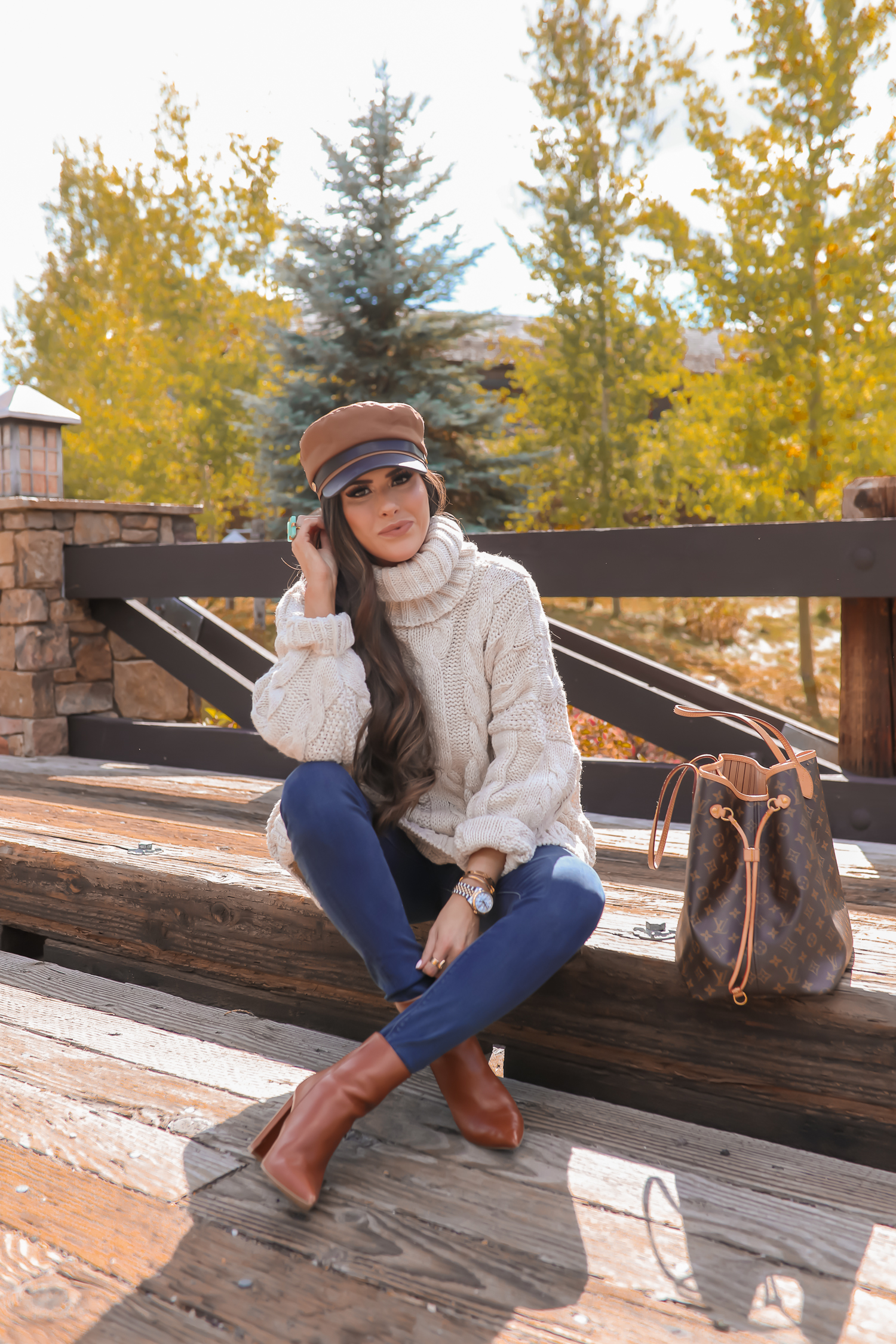 Cable knit sweater styled for Fall by top US fashion blog, The Sweetest Thing: image of a woman wearing a Topshop cable knit sweater, Express jeans, Steve Madden booties, Louis Vuitton handbag and Free People Ring | jackson hole fashion blogger, fall fashion 2019, oversized sweaters topshop nordstorm