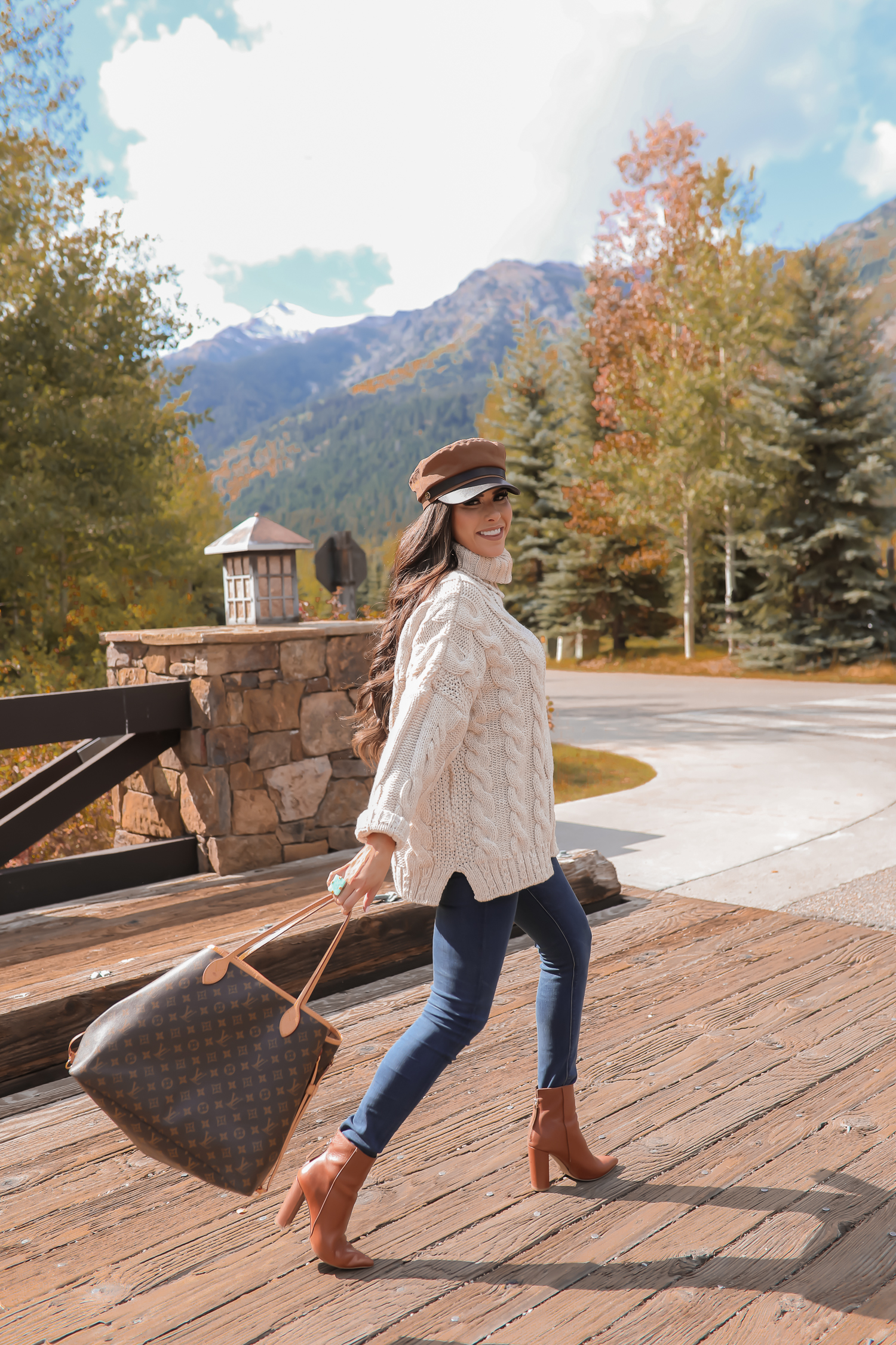 Cable knit sweater styled for Fall by top US fashion blog, The Sweetest Thing: image of a woman wearing a Topshop cable knit sweater, Express jeans, Steve Madden booties, Louis Vuitton handbag and Free People Ring | jackson hole fashion blogger, fall fashion 2019, oversized sweaters topshop nordstorm