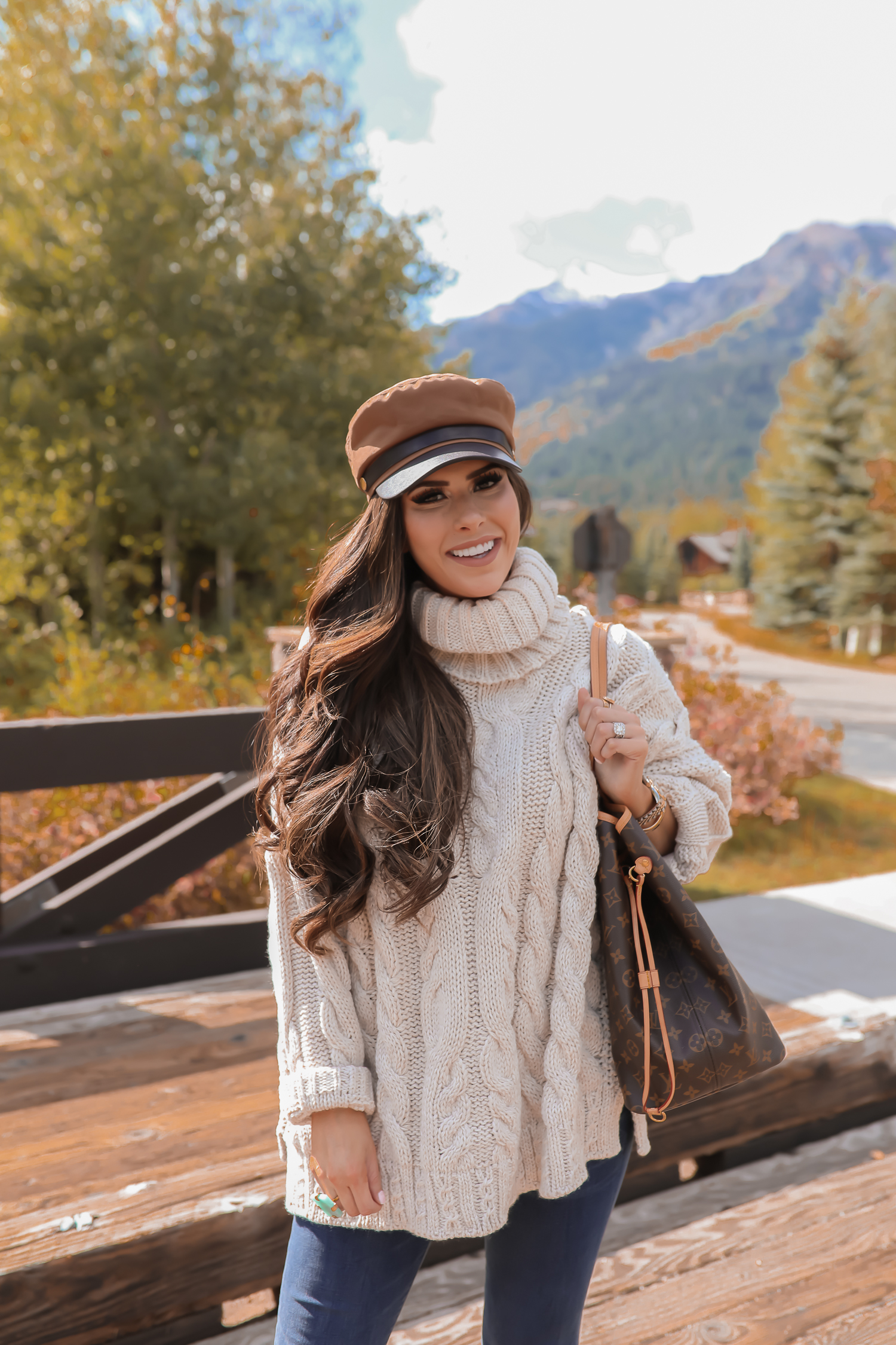 Cable knit sweater styled for Fall by top US fashion blog, The Sweetest Thing: image of a woman wearing a Topshop cable knit sweater, Express jeans, Steve Madden booties, Louis Vuitton handbag and Free People Ring.| fall sweaters and booties pinterest 2019,jackson hole fashion blogger, fall fashion 2019, oversized sweaters topshop nordstorm