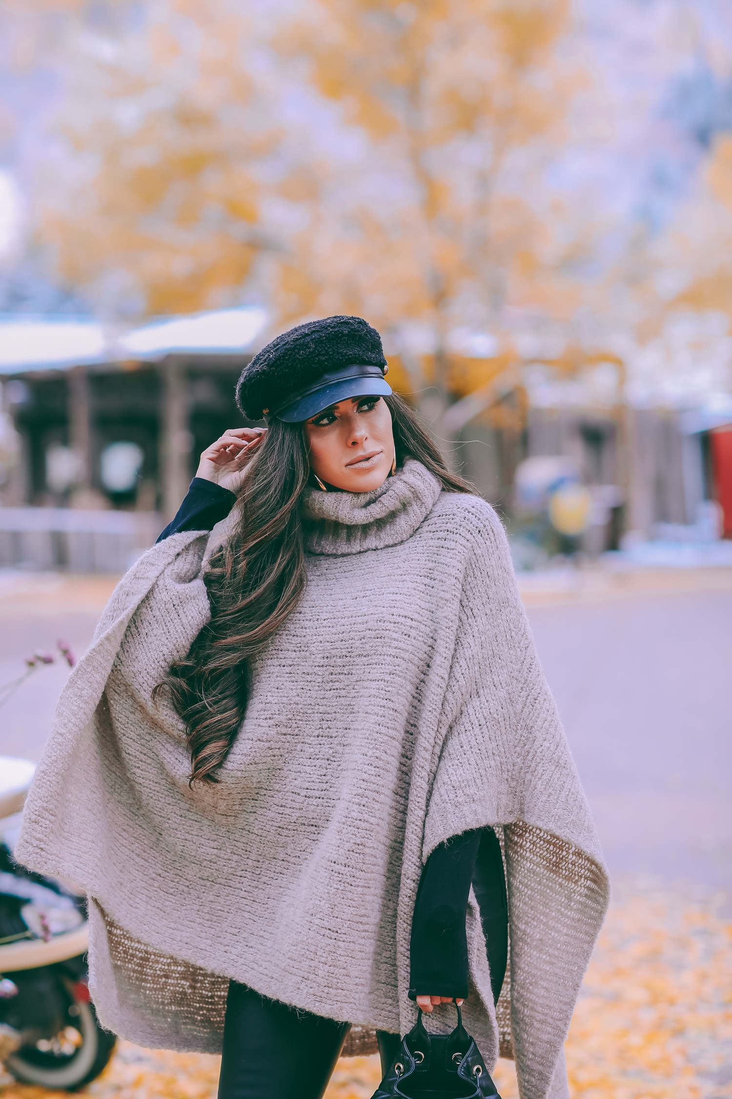 Cute snow day outfits styled by top US fashion blog, The Sweetest Thing: image of a woman wearing a Caslon black top, BlankNYC pants, See by Chloe boots, Leith baker boy cap, and a Chanel backpack | winter 2019 fashion outfits pinterest, mango cape poncho, chanel black quilted backpack, aspen fashion blogger, emily gemma, cute outfits for aspen-2