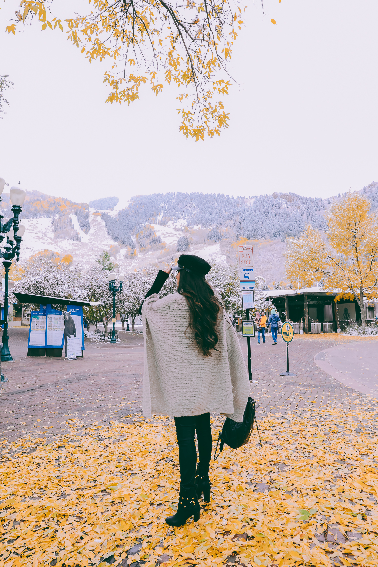 Cute snow day outfits styled by top US fashion blog, The Sweetest Thing: image of a woman wearing a Caslon black top, BlankNYC pants, See by Chloe boots, Leith baker boy cap, and a Chanel backpack | winter 2019 fashion outfits pinterest, mango cape poncho, chanel black quilted backpack, aspen fashion blogger, emily gemma, cute outfits for aspen-2