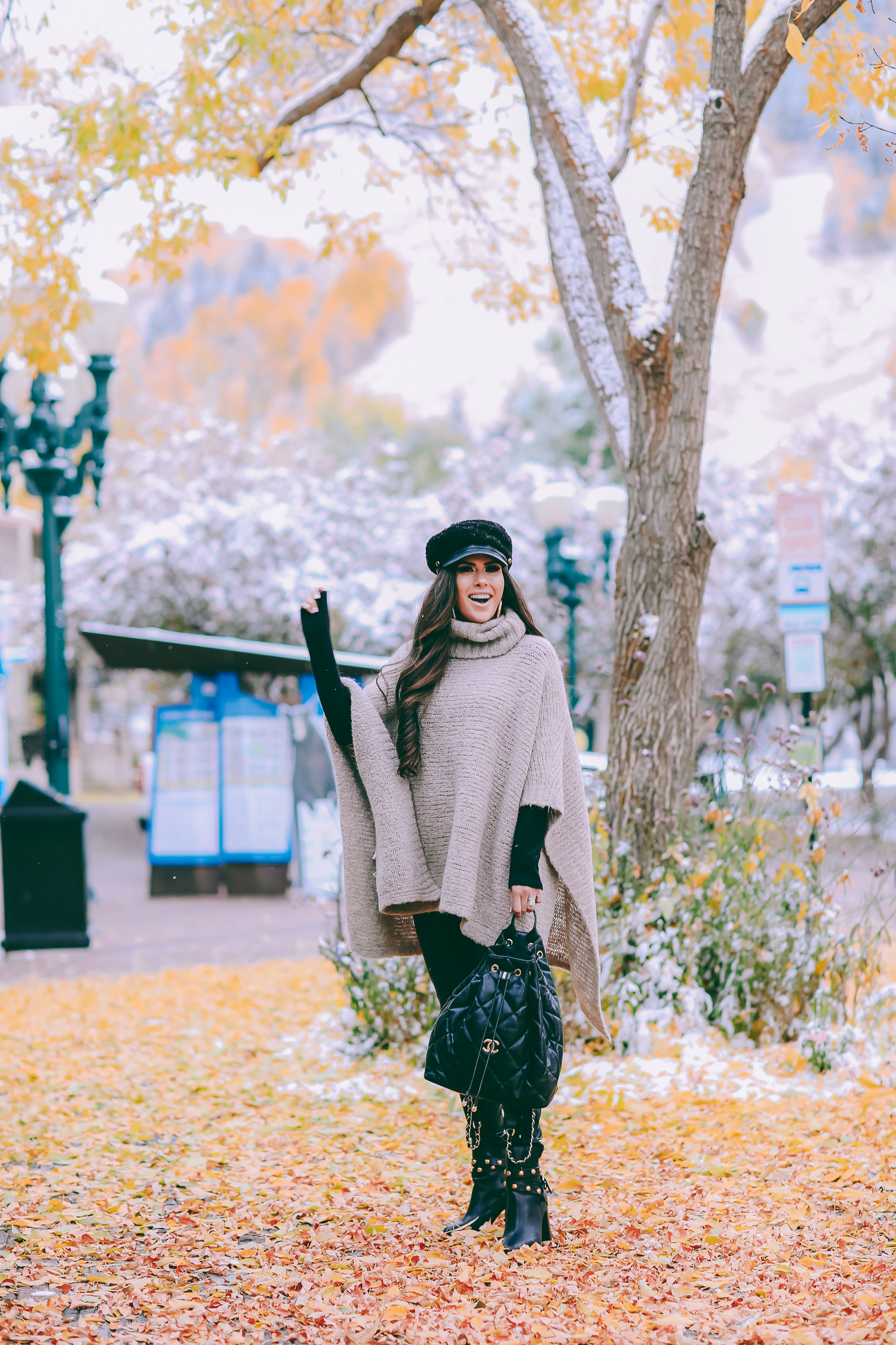 Cute snow day outfits styled by top US fashion blog, The Sweetest Thing: image of a woman wearing a Caslon black top, BlankNYC pants, See by Chloe boots, Leith baker boy cap, and a Chanel backpack | winter 2019 fashion outfits pinterest, mango cape poncho, chanel black quilted backpack, aspen fashion blogger, emily gemma, cute outfits for aspen-2