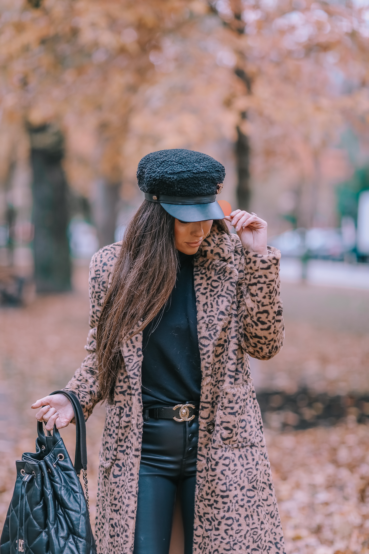 Faux Fur Leopard Coat styled by top US fashion blogger, Emily Gemma of The Sweetest Thing: image of a woman wearing a Mural faux fur leopard coat.