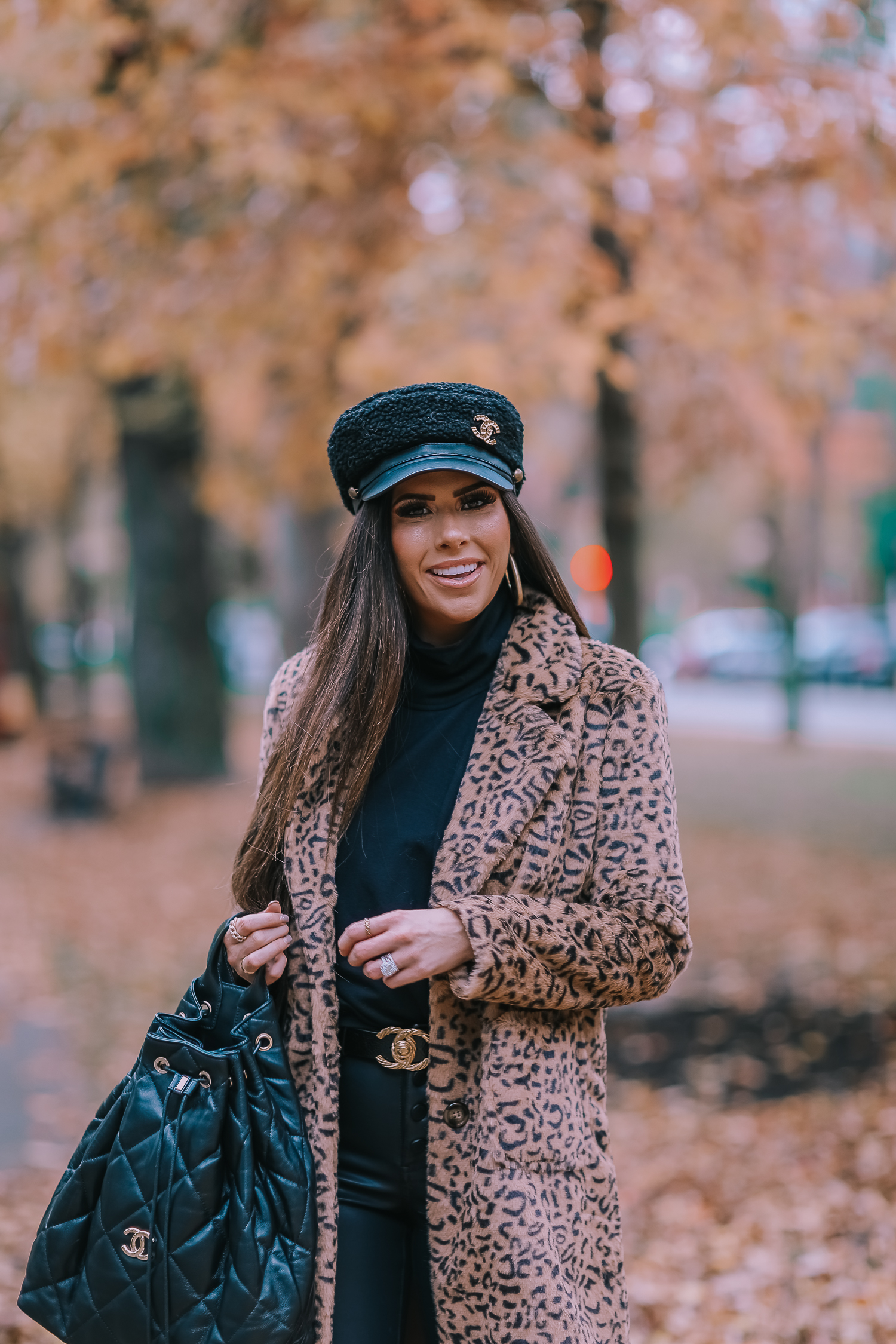 Faux Fur Leopard Coat styled by top US fashion blogger, Emily Gemma of The Sweetest Thing: image of a woman wearing a Mural faux fur leopard coat.