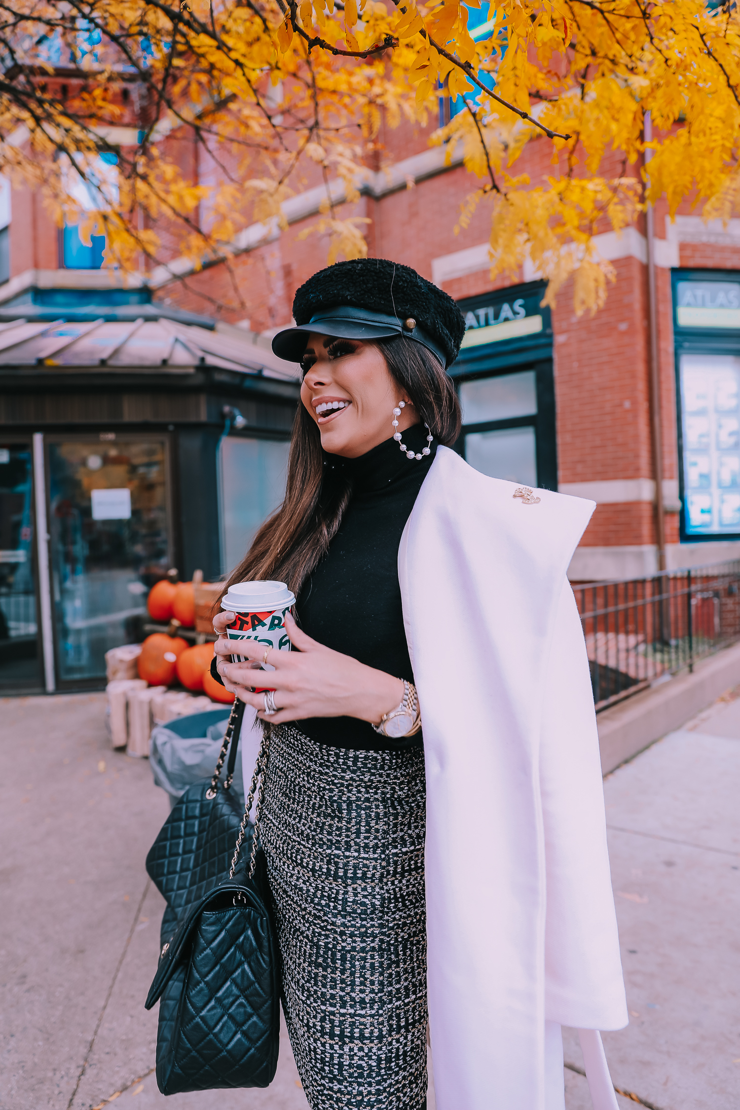 Classic Winter Outfit featured by top US fashion blog, The Sweetest Thing: image of a woman wearing an Express white coat, an Express black turtleneck, an Express tweed skirt, Gucci tights, and a Chanel bag. | fall outfit ideas pinterest 2019, black gucci tights outfit idea, pinterest gucci tight outfit idea, emily ann gemma, express fall fashion 2019, emily ann gemma, Chanel XXL airlines tote black-11