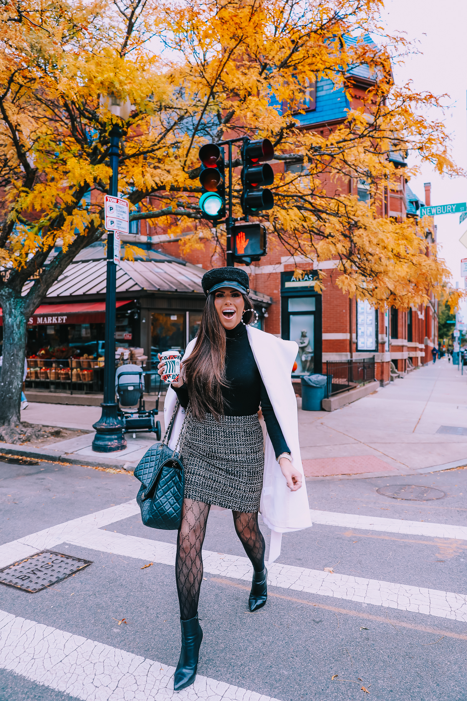 Classic Winter Outfit featured by top US fashion blog, The Sweetest Thing: image of a woman wearing an Express white coat, an Express black turtleneck, an Express tweed skirt, Gucci tights, and a Chanel bag.
