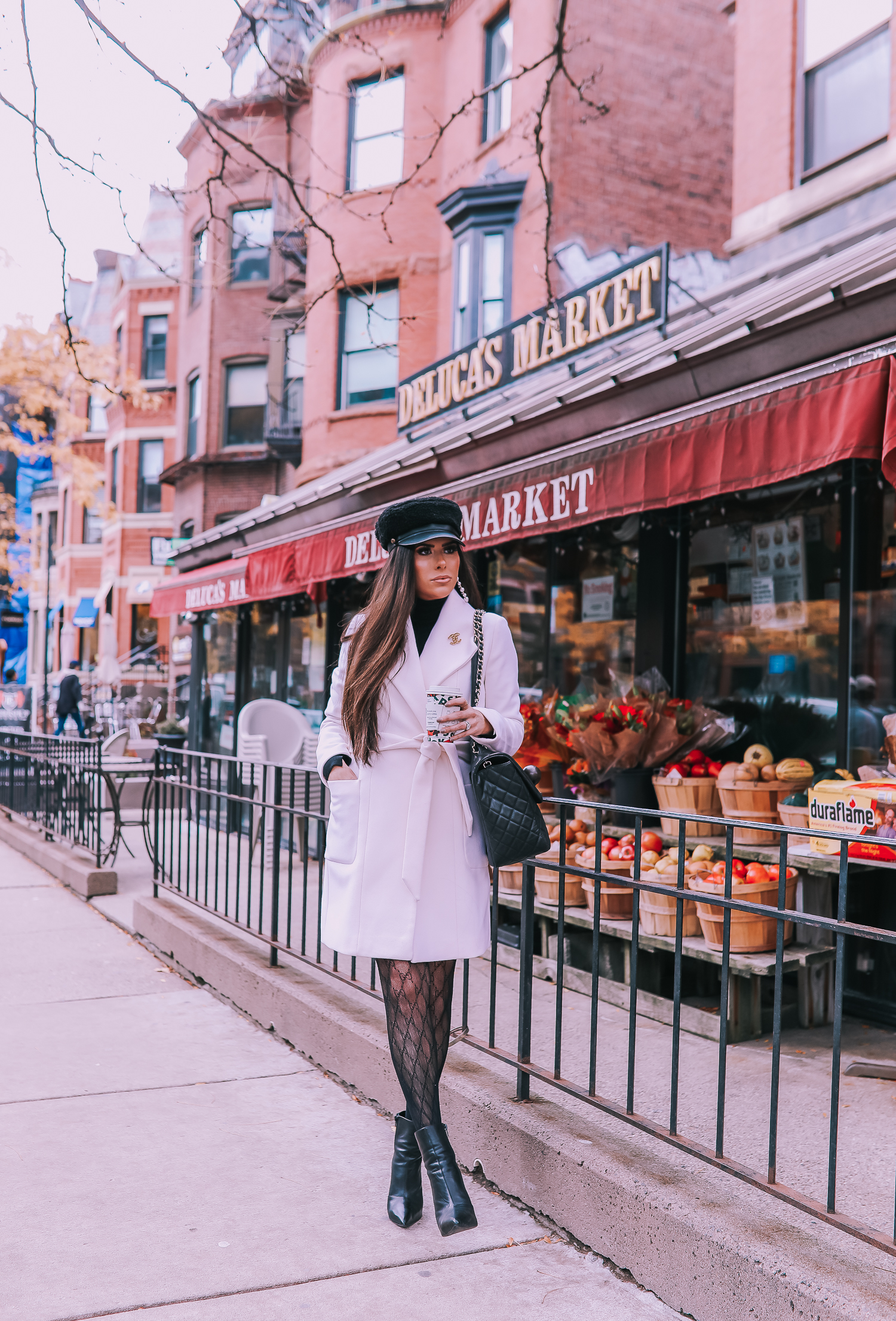 Classic Winter Outfit featured by top US fashion blog, The Sweetest Thing: image of a woman wearing an Express white coat, an Express black turtleneck, an Express tweed skirt, Gucci tights, and a Chanel bag. | fall outfit ideas pinterest 2019, black gucci tights outfit idea,boston fashion blog, emily ann gemma, express fall fashion 2019, emily ann gemma, 