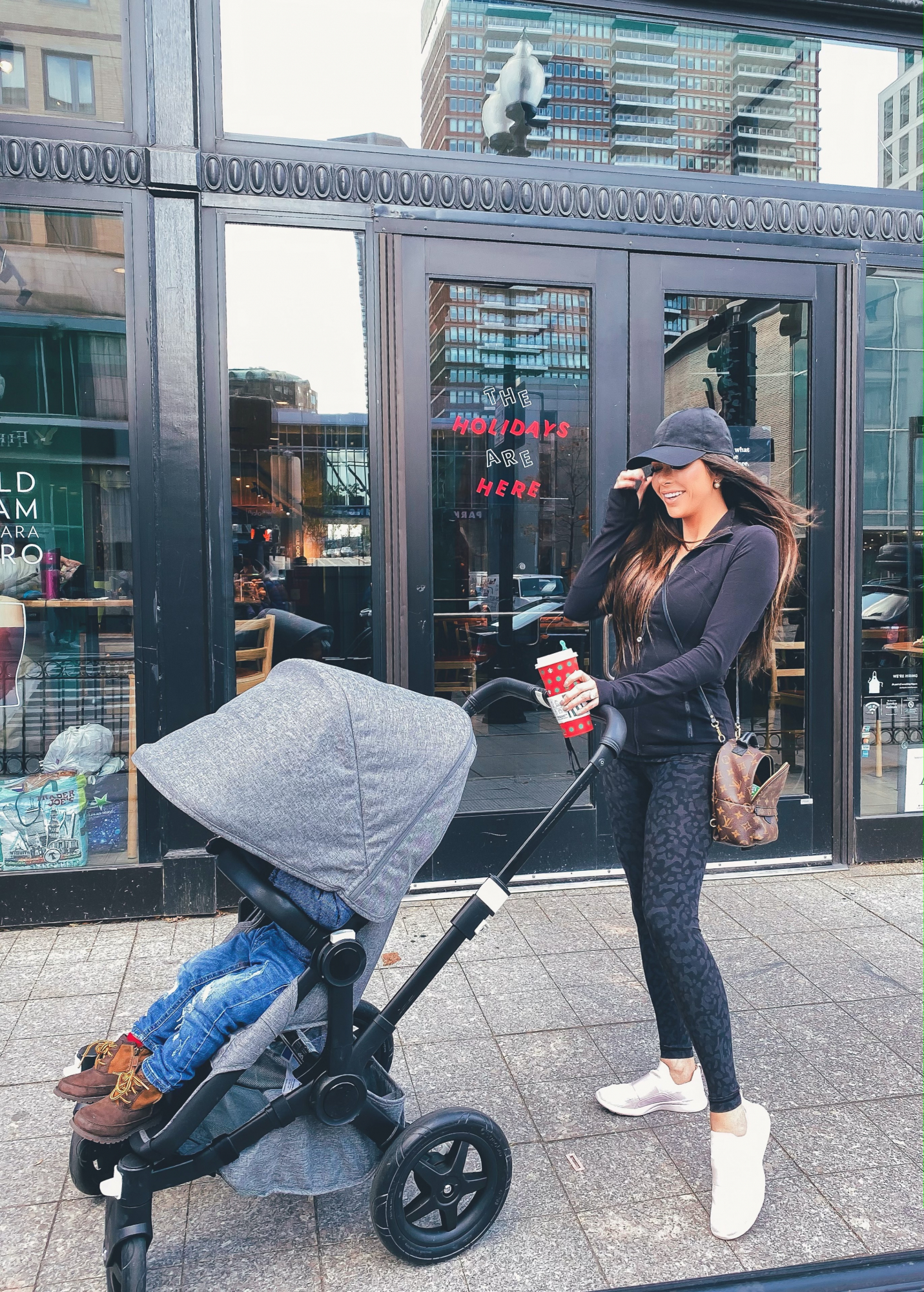 boston 2019 winter, luluelmon outfit | A YEAR IN REVIEW : MASSIVE 2019 INSTAGRAM RECAP by popular Oklahoma life and style blog, The Sweetest Thing: image of a woman pushing a Nordstrom Donkey2 Classic Mono Complete Stroller with Bassinet BUGABOO and wearing a Lululemon Baller Hat Run, ShopBop APL: Athletic Propulsion Labs TechLoom Bliss Sneakers, Lululemon Define Jacket, and holding a Louis Vuitton mini backpack. 