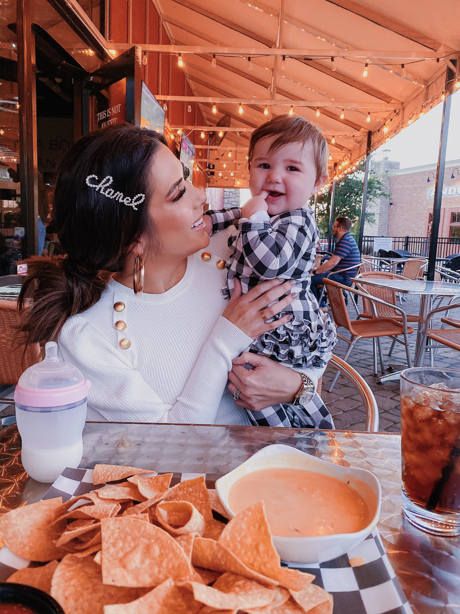 chanel hair clip cursive, emily gemma, tulsa fashion blogger | A YEAR IN REVIEW : MASSIVE 2019 INSTAGRAM RECAP by popular Oklahoma life and style blog, The Sweetest Thing: image of a mom holding her baby and wearing a Zara sweater. 