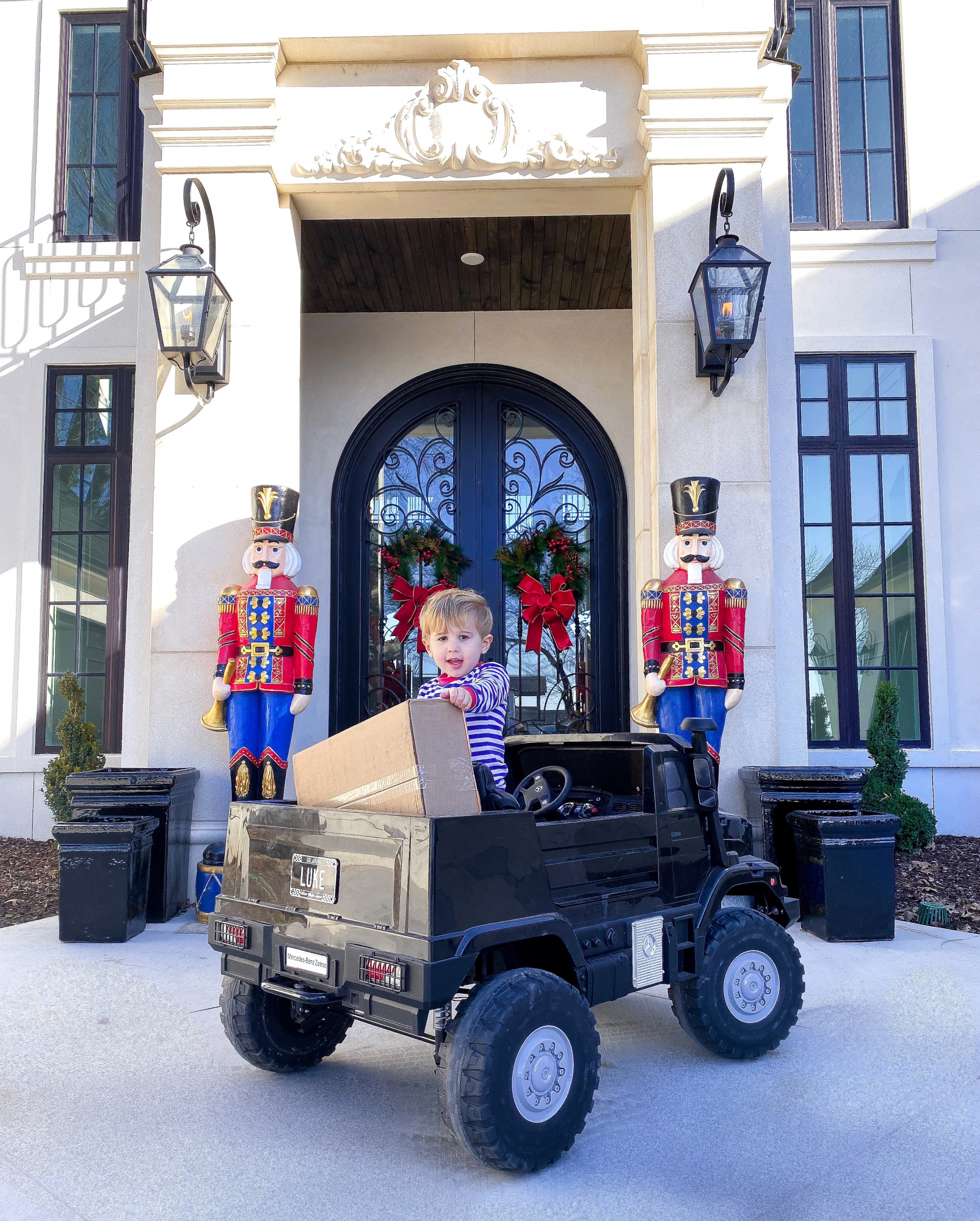 christmas front door decor pinterest 2019 nutcrackers, kids remote mercedes trucks, emily gemma | A YEAR IN REVIEW : MASSIVE 2019 INSTAGRAM RECAP by popular Oklahoma life and style blog, The Sweetest Thing: image of a little boy wearing Smocked auctions pajamas. 