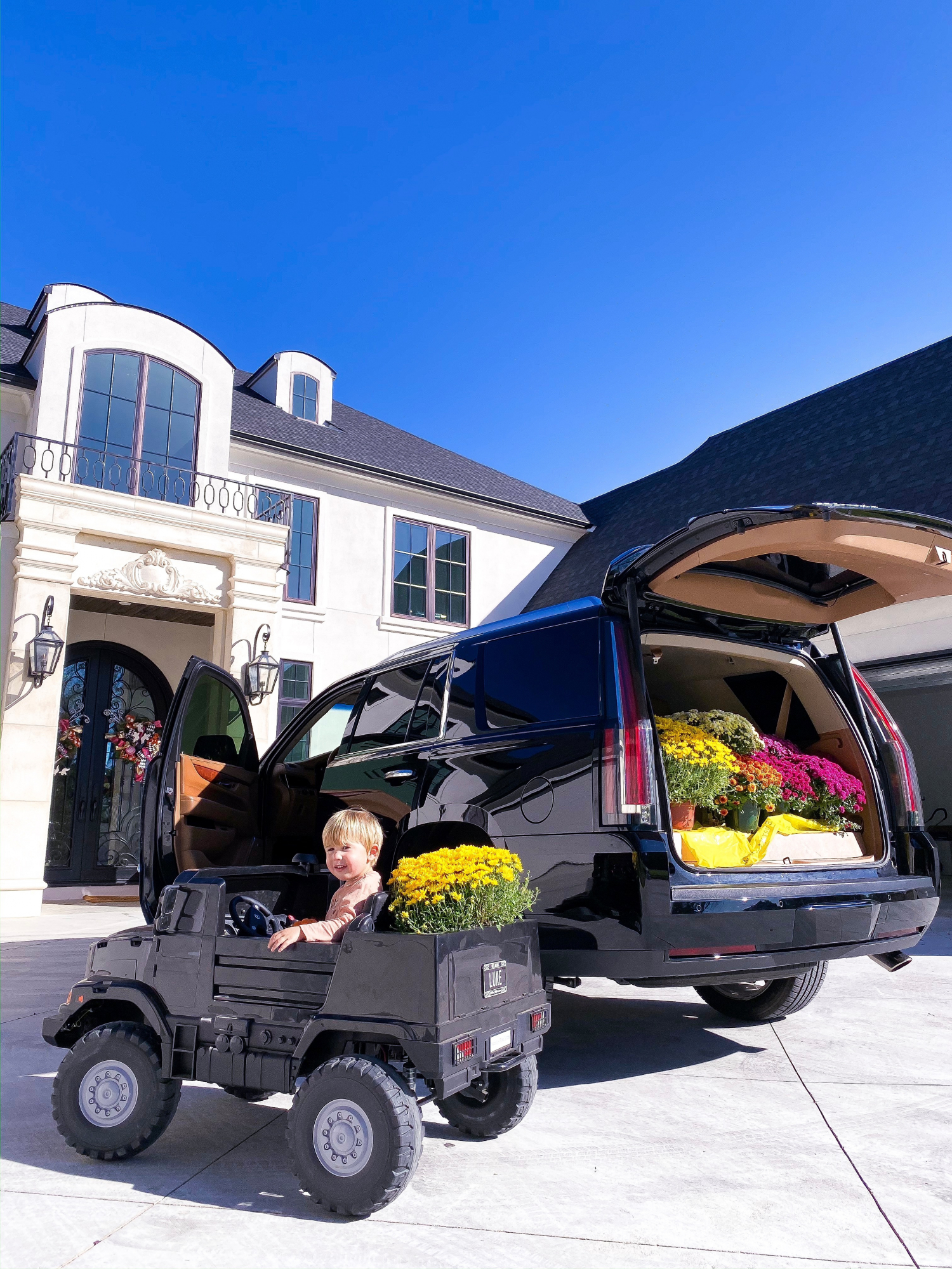 kids mercedes benz remote two seater truck, fall front door decor, emily gemma | A YEAR IN REVIEW : MASSIVE 2019 INSTAGRAM RECAP by popular Oklahoma life and style blog, The Sweetest Thing: image of a little boy riding in a Mercedes Zetros 24 Volt Remote Control Ride On 2 Seat Truck. 
